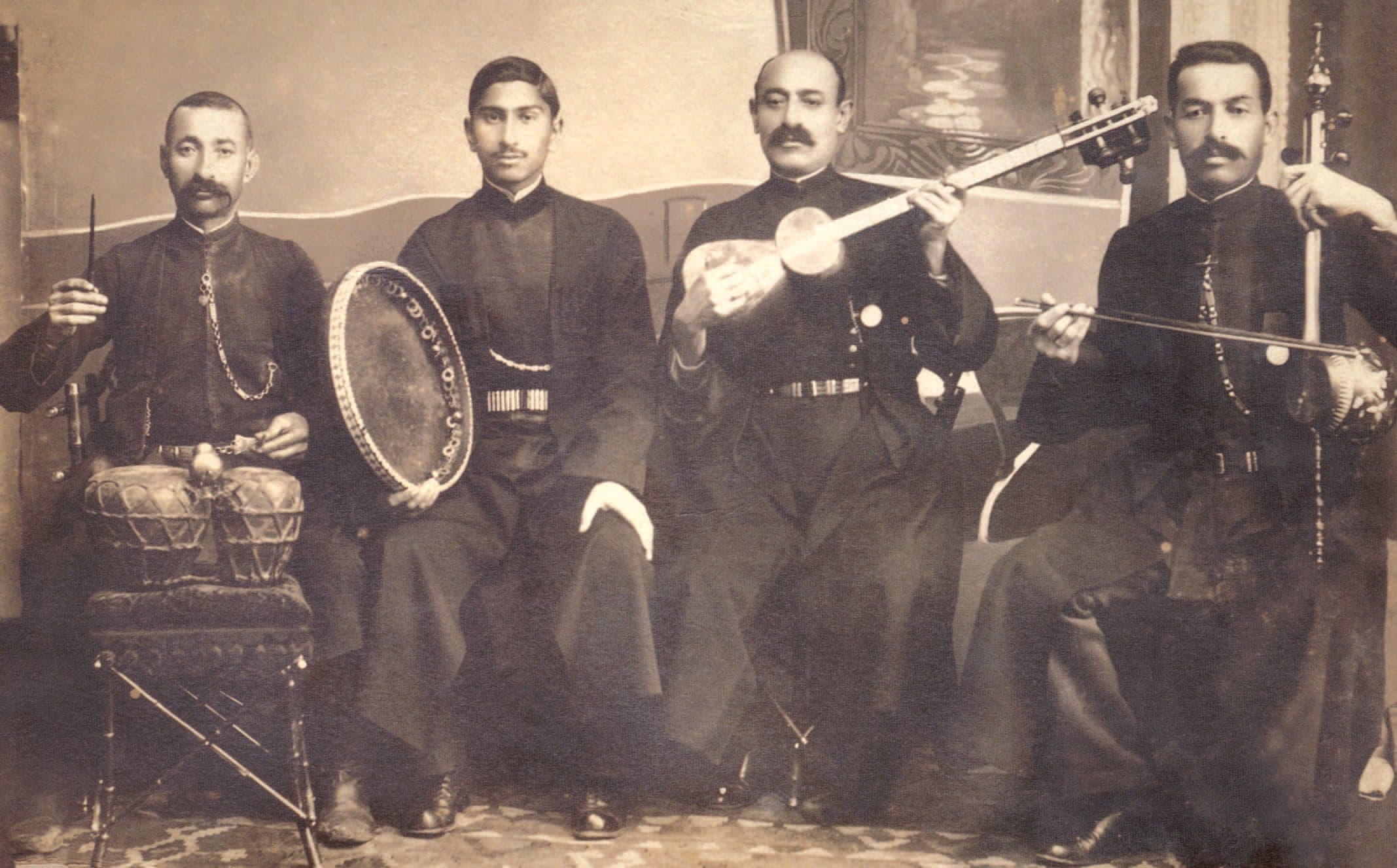 A mugham trio with singer, tar player and kamancha player performing on stage