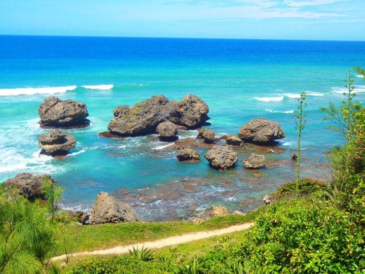 Giant rounded boulders rising from the surf at Bathsheba beach, Barbados