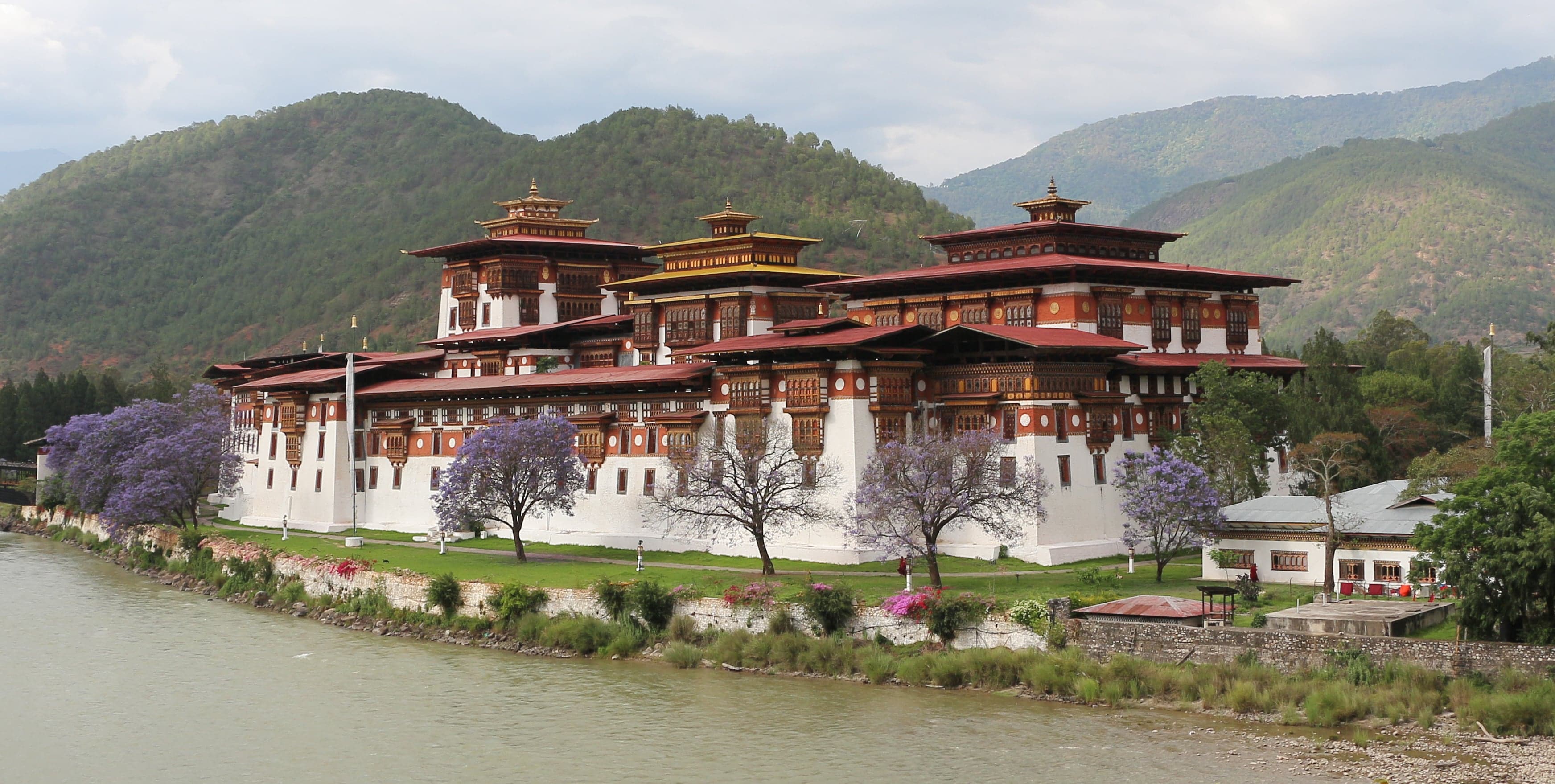 The white-walled Punakha Dzong fortress surrounded by a river and mountains