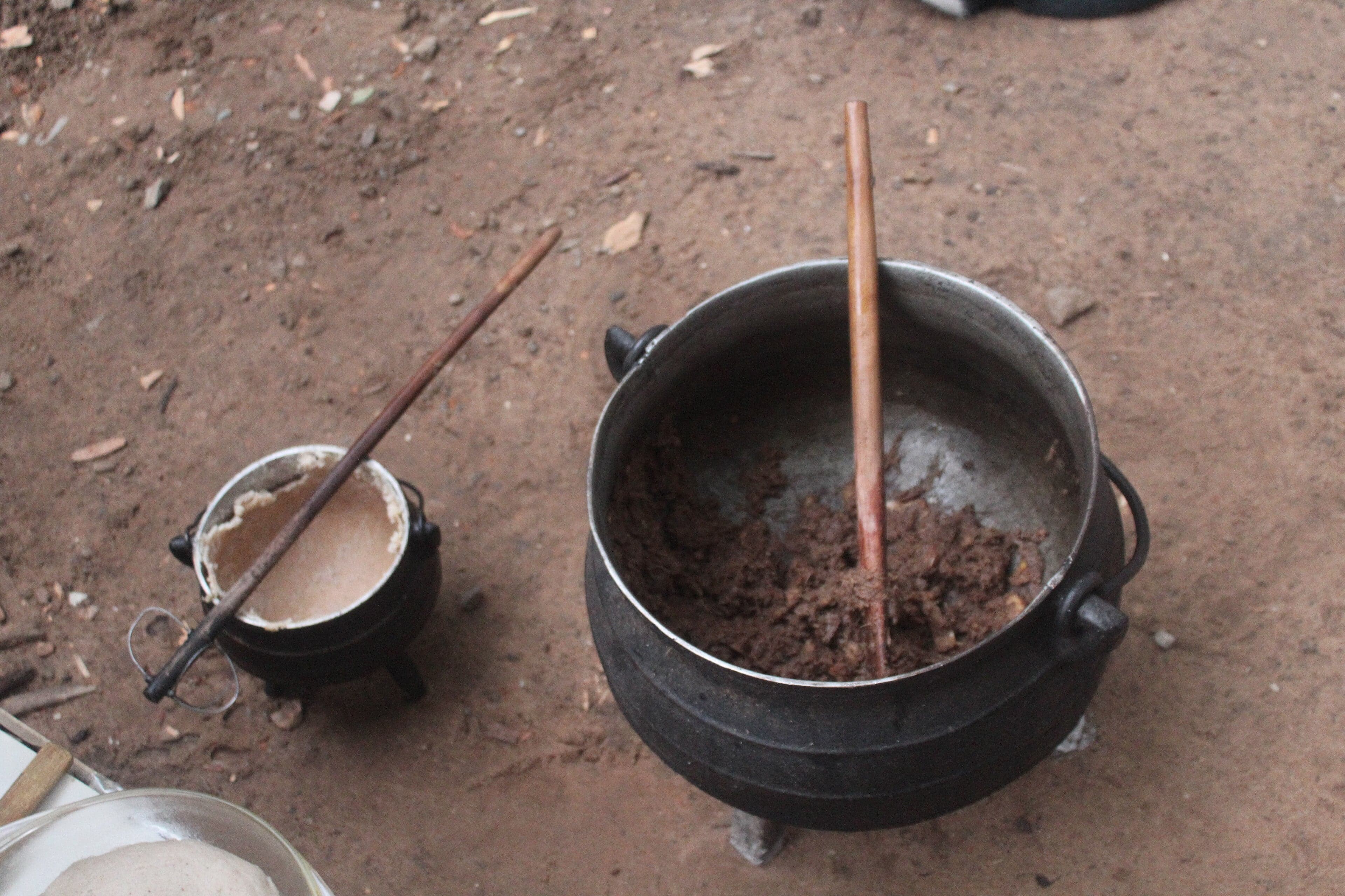A plate of golden-brown magwinya fat cakes, fluffy and crispy on the outside