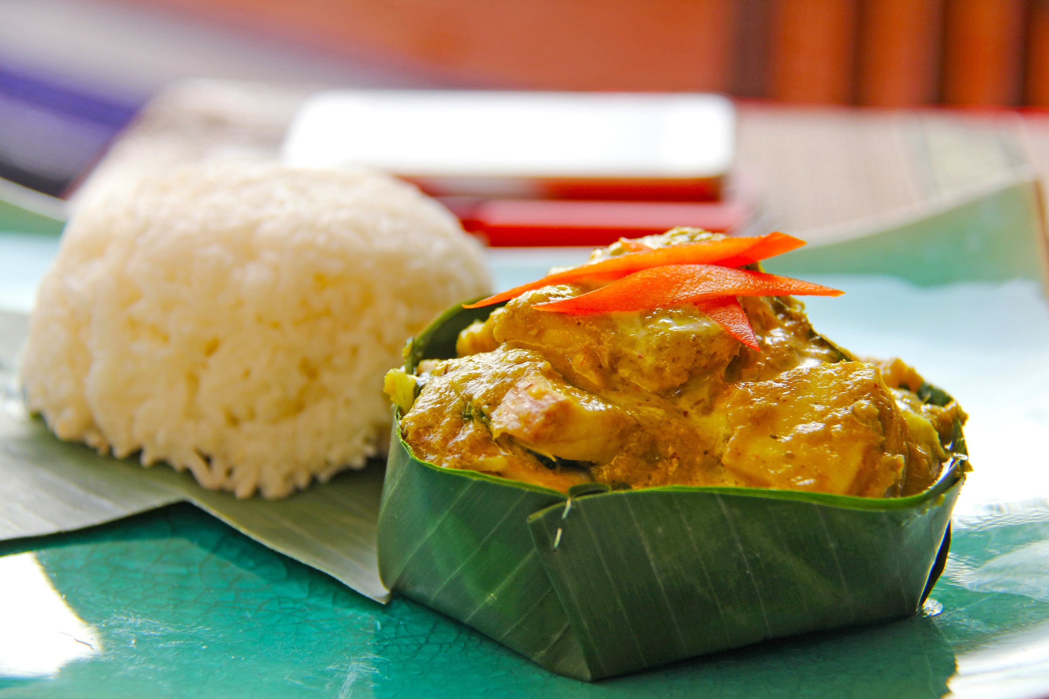 Amok trey steamed fish curry served in a banana leaf bowl