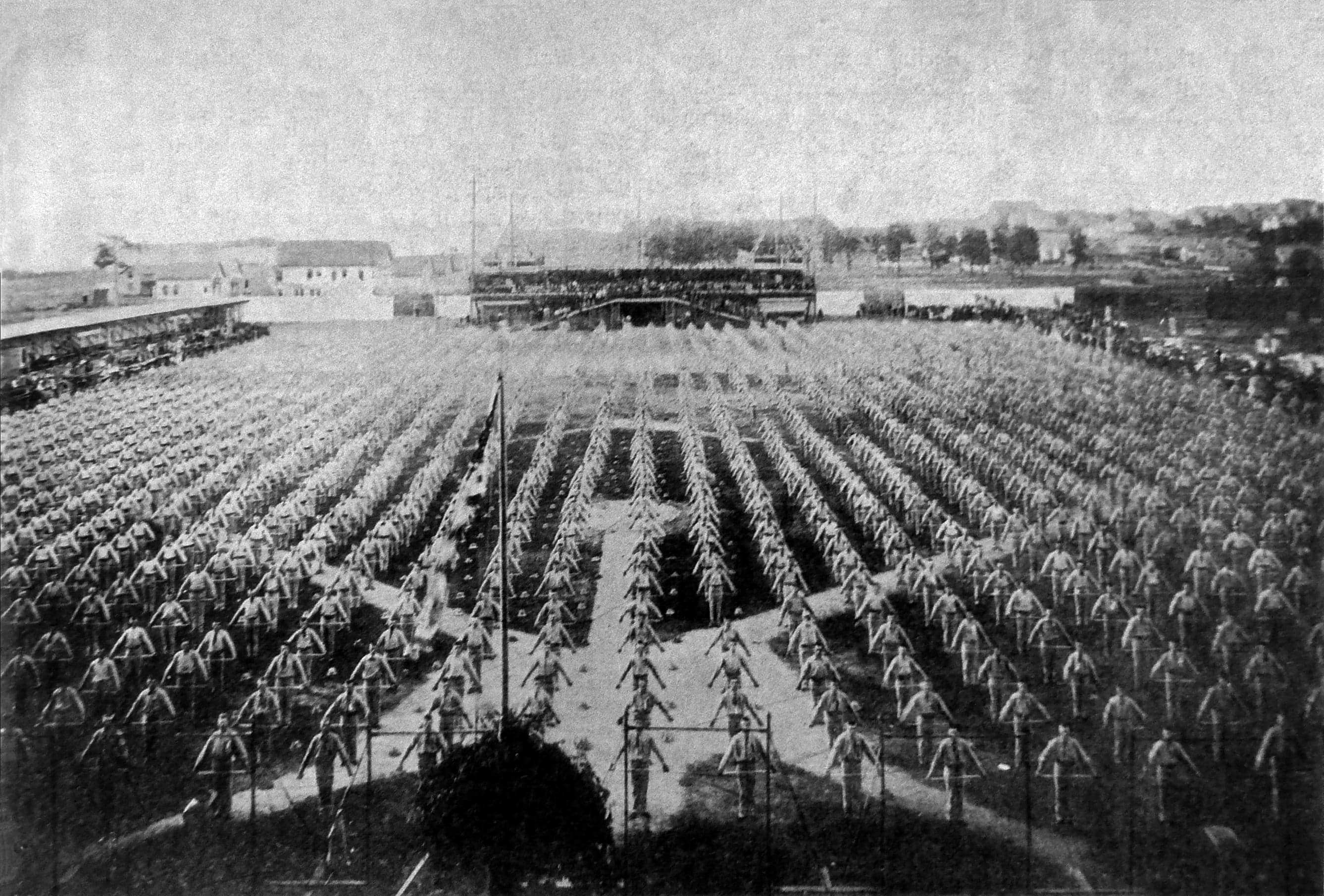 Hundreds of Sokol gymnasts performing a synchronised display in a large stadium