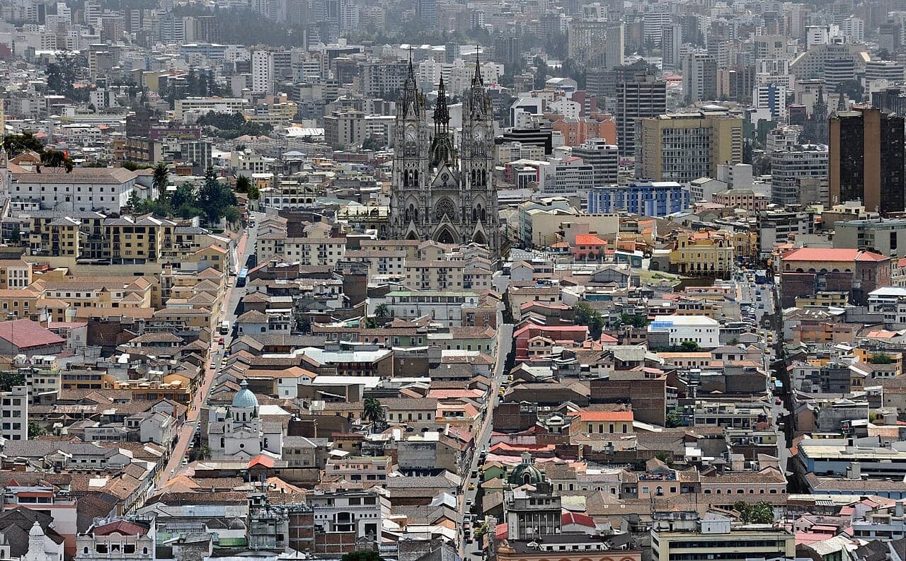 The colourful colonial buildings and churches of Quito's historic old town with the Andes behind