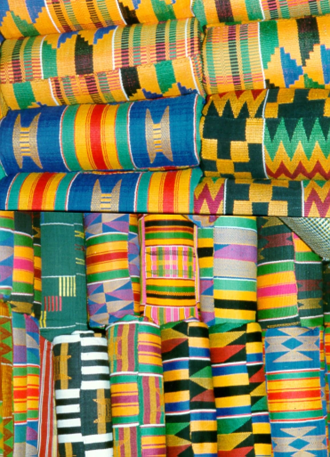 Brightly coloured kente cloth woven in geometric patterns