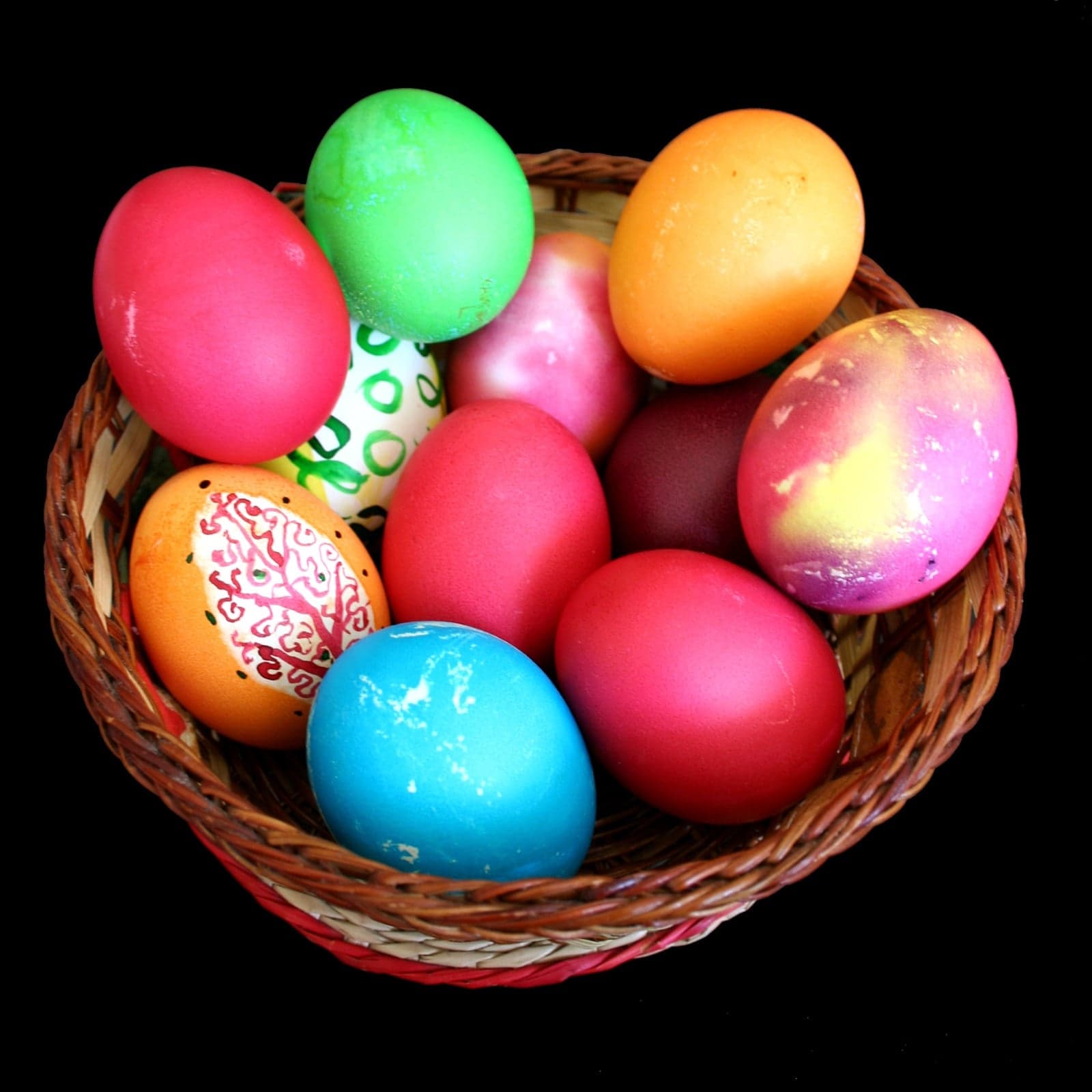 A basket of bright red-painted Easter eggs on a Greek table