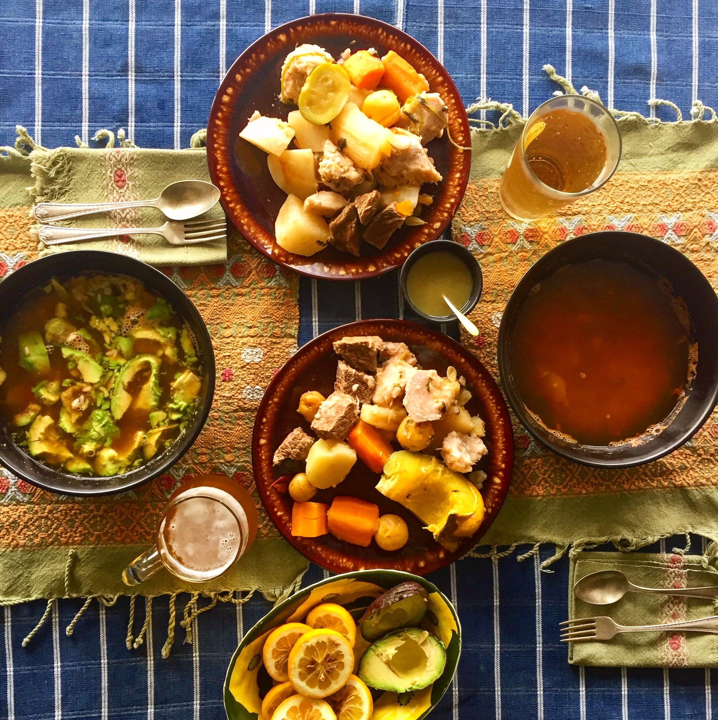 A plate of jocón, a vivid green chicken stew served with rice and tortillas