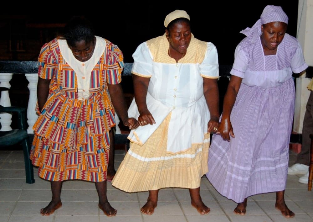 Garifuna people in traditional dress parading and celebrating along the Caribbean coast of Honduras