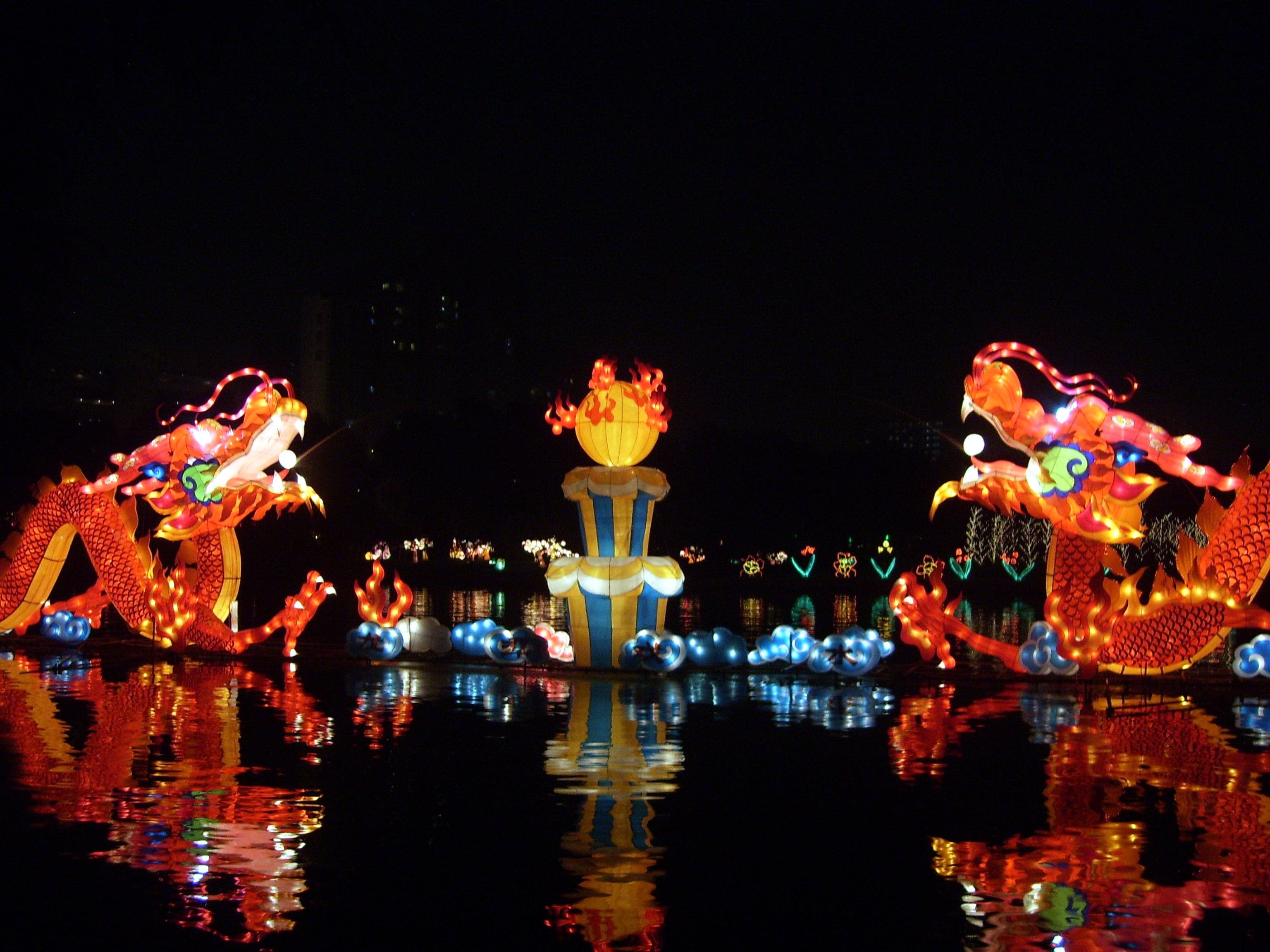 Children carrying glowing lanterns at night during the Mid-Autumn Festival in Hong Kong