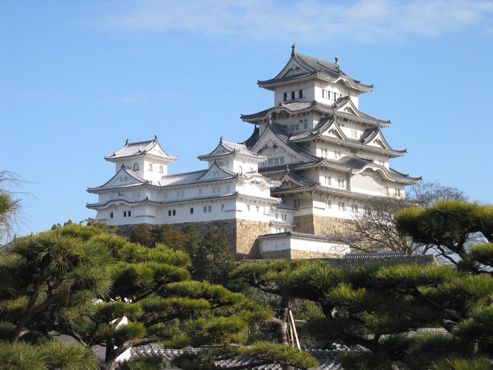 Himeji Castle, a brilliant white Japanese castle with stacked curved roofs