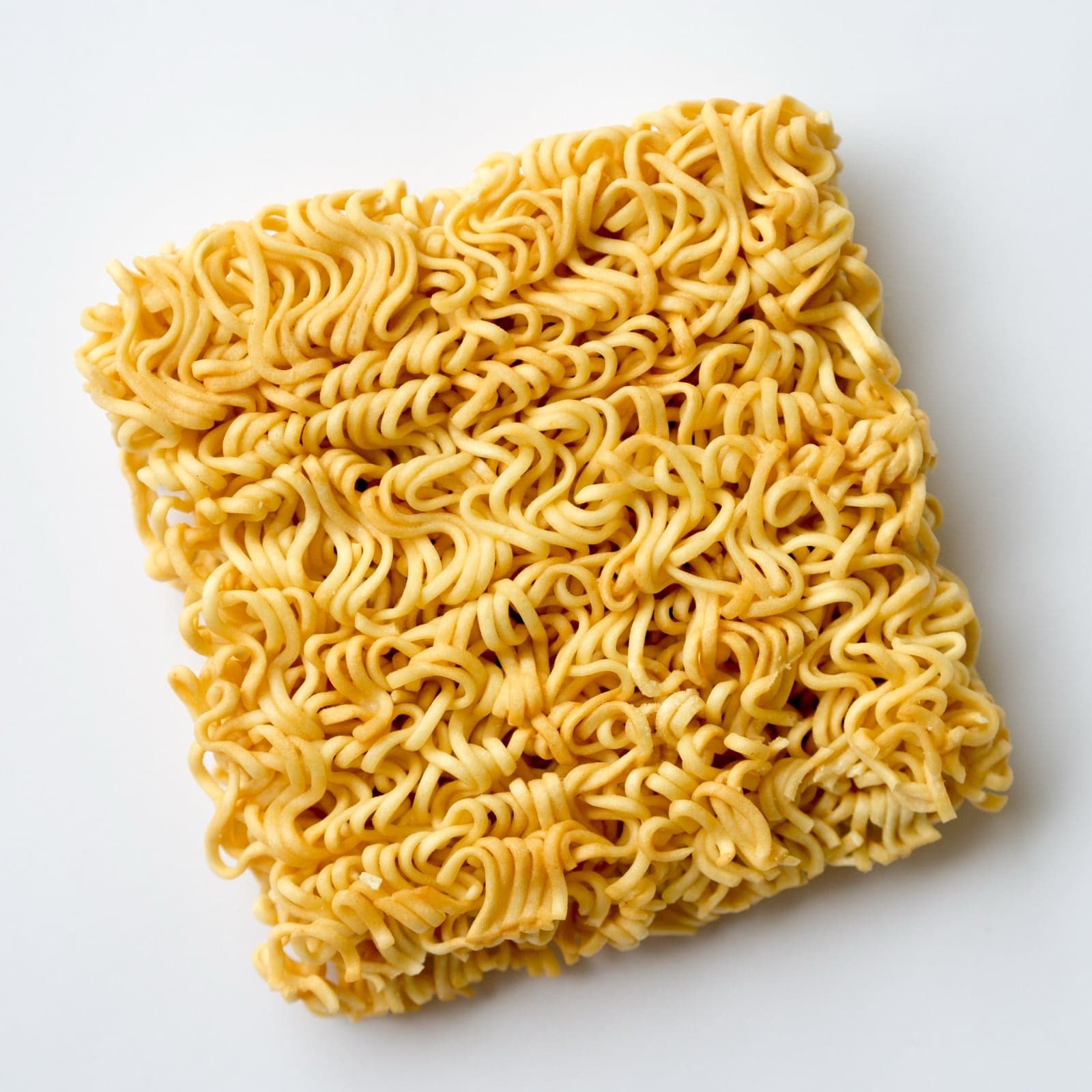 A square block of dried instant noodles - a Japanese invention from 1958