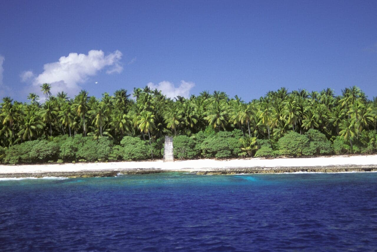 The rocky limestone cliffs of Banaba rising above the Pacific Ocean