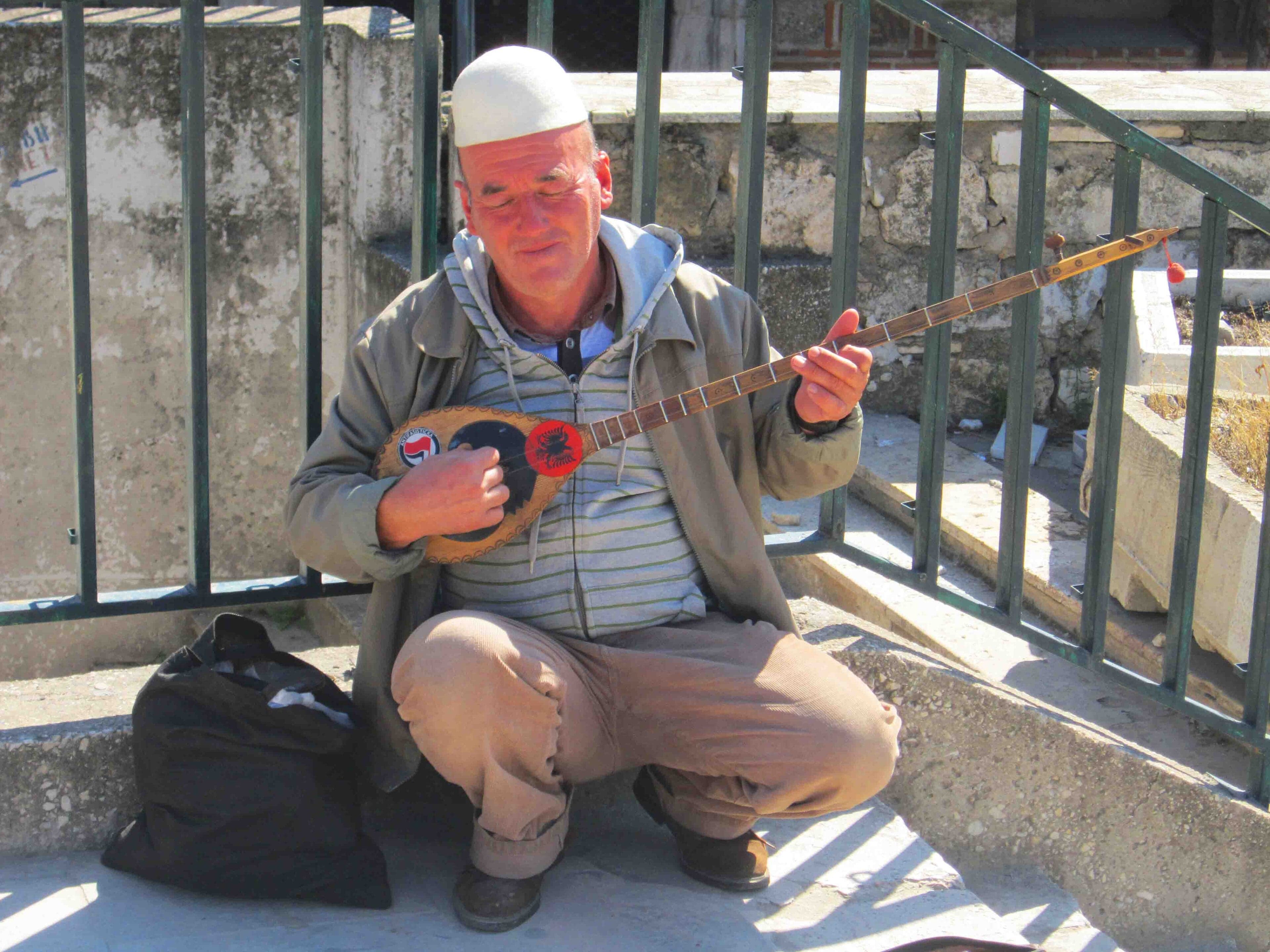 A craftsman holding a handmade çifteli two-stringed lute