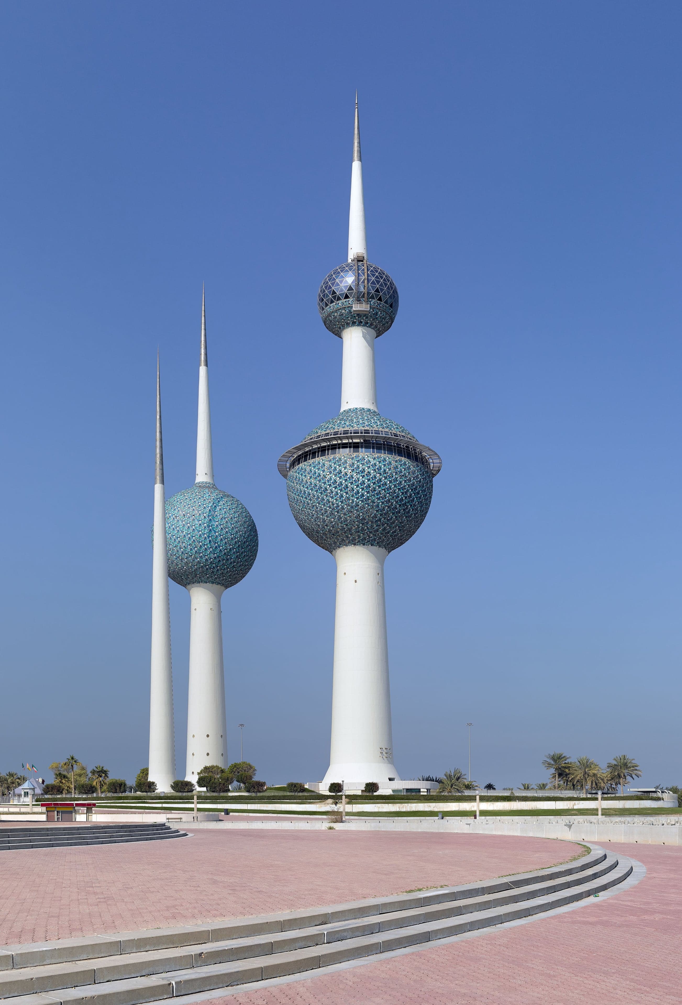 The three blue-sphere Kuwait Towers rising above the Arabian Gulf coastline