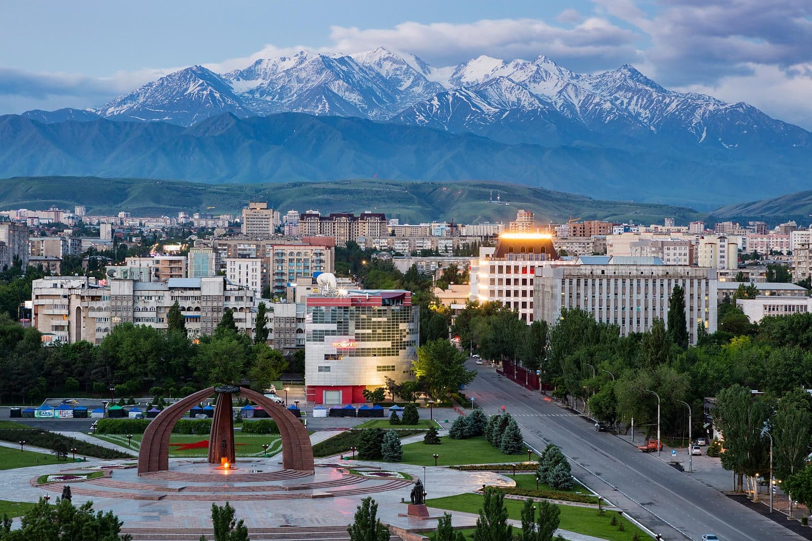 Tree-lined streets of Bishkek with the Tien Shan mountains visible in the background