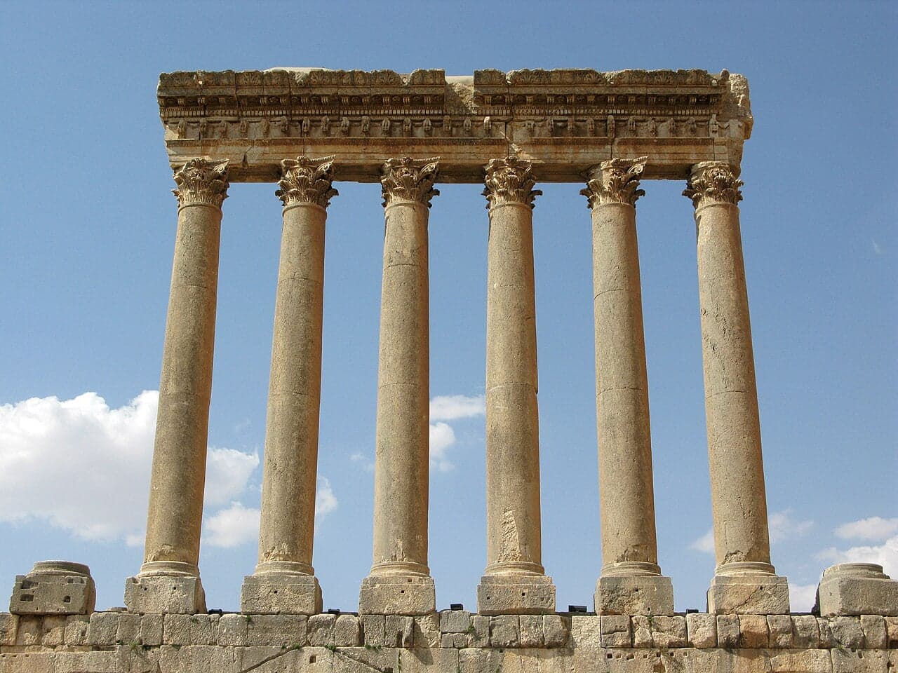The huge columns of the Temple of Bacchus at Baalbek with the sky behind them