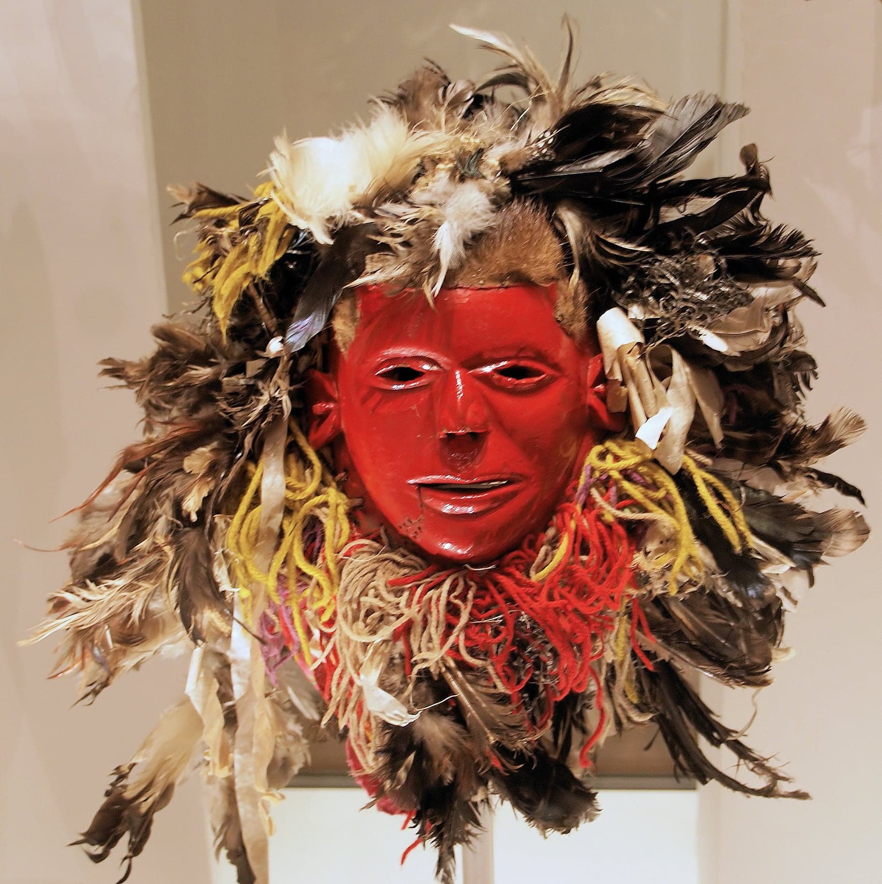 Gule Wamkulu performers in elaborate masks and costumes dancing at a Malawian ceremony