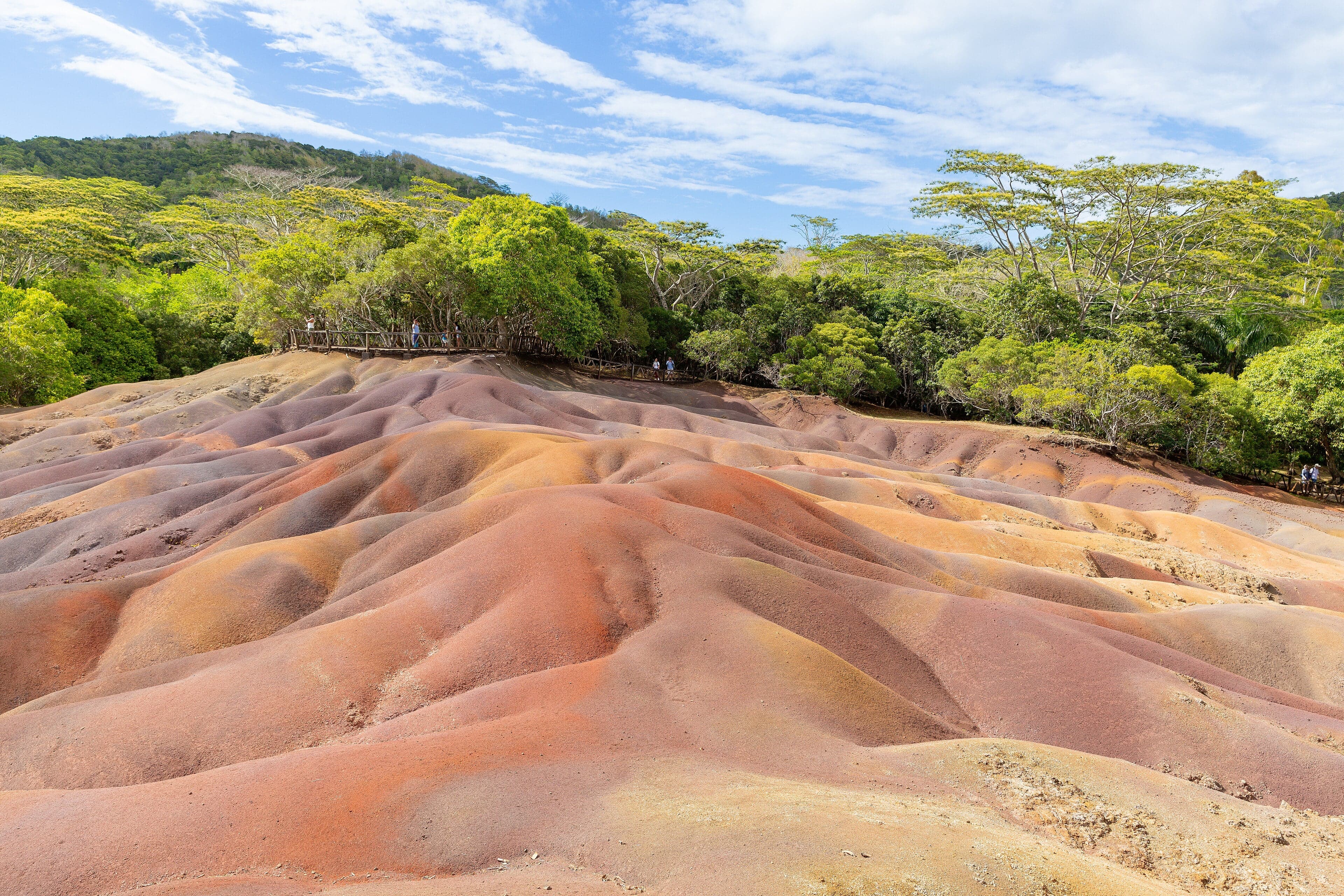 Swirling dunes of red, brown, violet, yellow and green earth at Chamarel, Mauritius