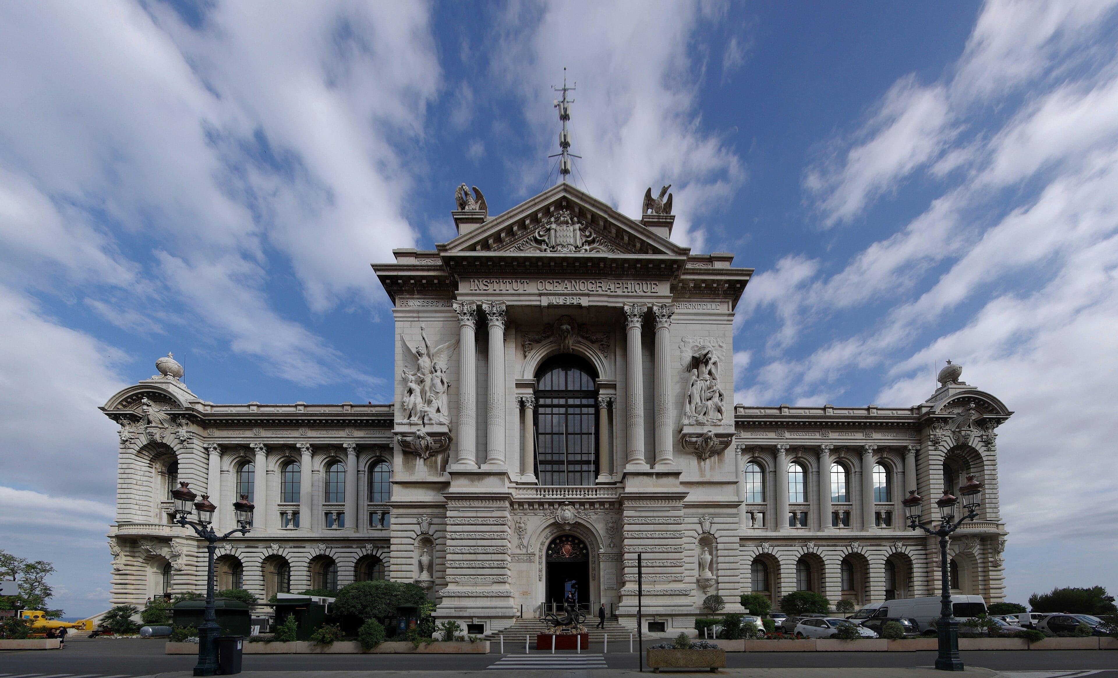 The grand stone facade of the Oceanographic Museum perched on the cliff above the sea