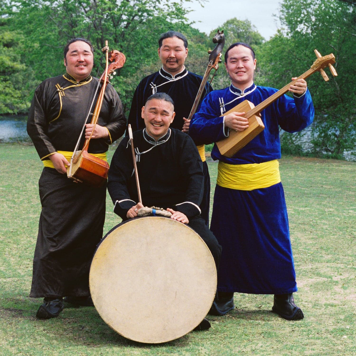 A Mongolian musician performing throat singing in traditional deel clothing