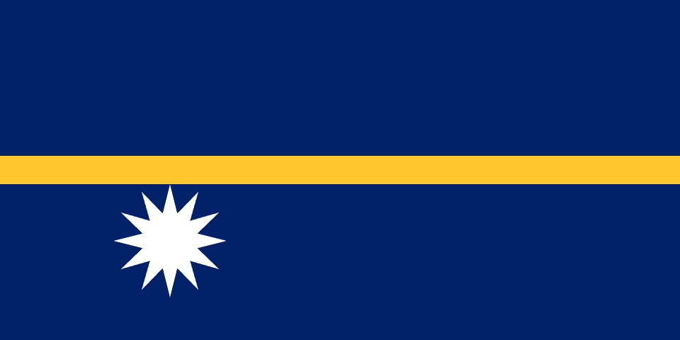 Nauruan flag flying with community members gathered to celebrate Independence Day