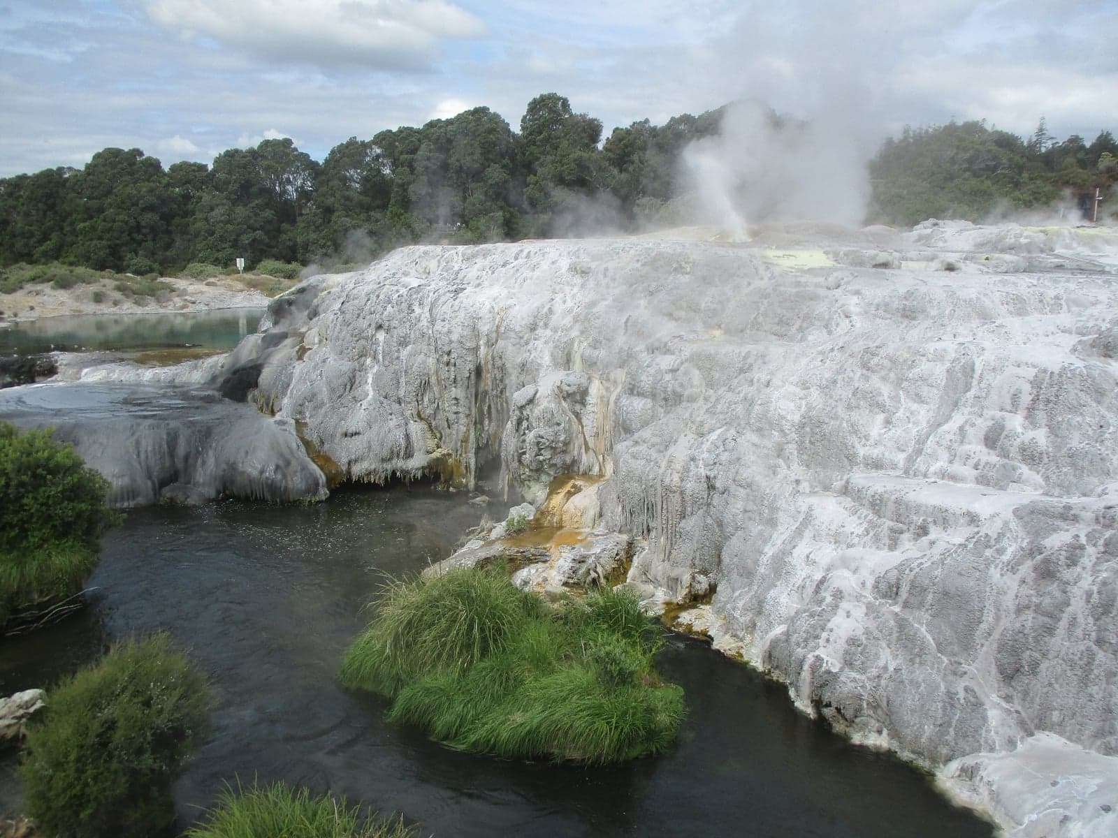 Steaming geothermal pools and silica terraces in Rotorua, New Zealand