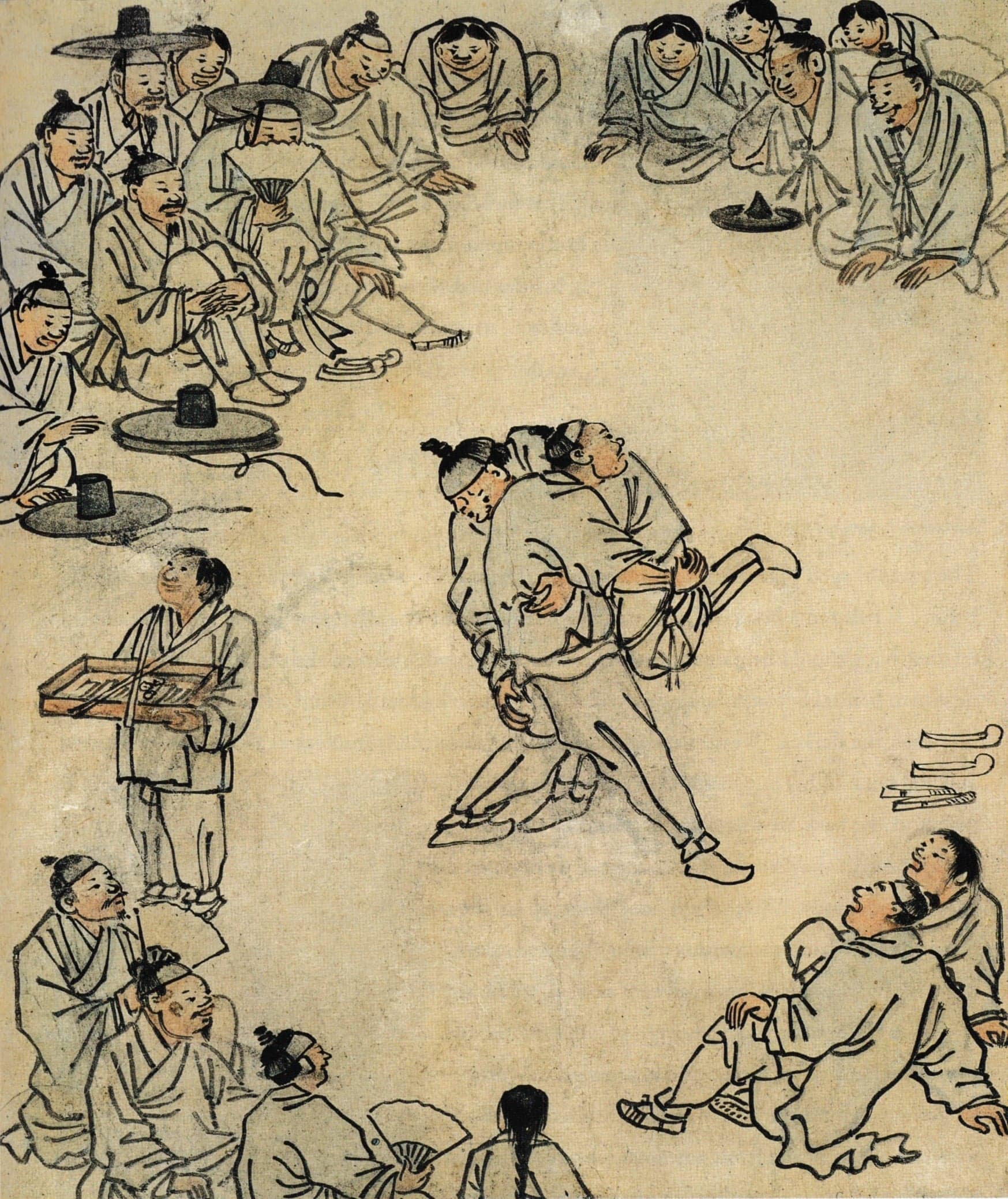 Two wrestlers in traditional Korean white outfits gripping each other's coloured sashes in a sandy ring