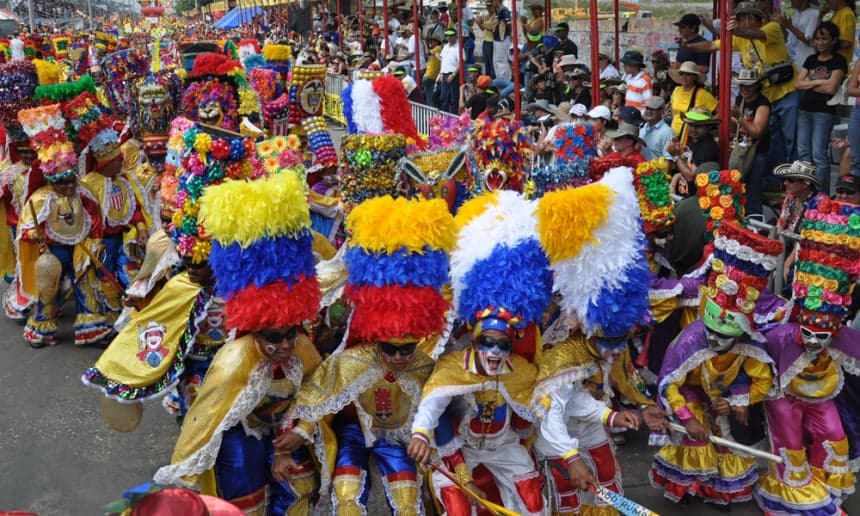 Dancers in colourful feathered costumes parading at the Las Tablas Carnival