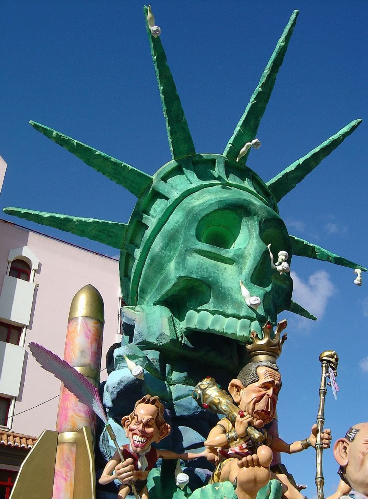 A Portuguese Carnaval parade with colourful costumes and giant paper-mâché heads