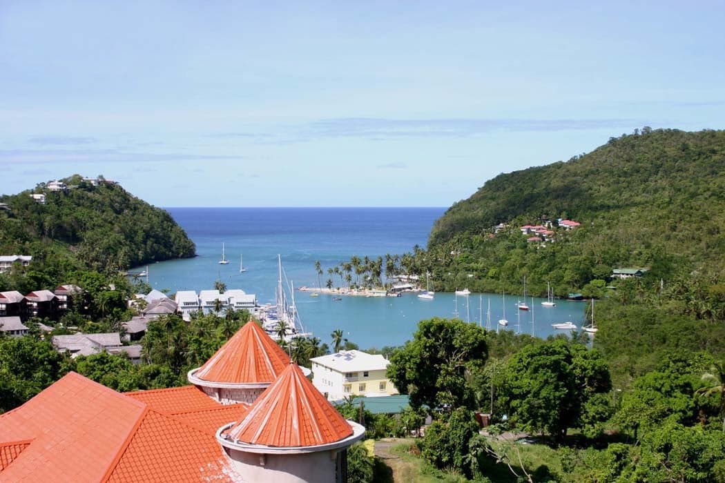 Calm turquoise water surrounded by lush green hills at Marigot Bay in Saint Lucia