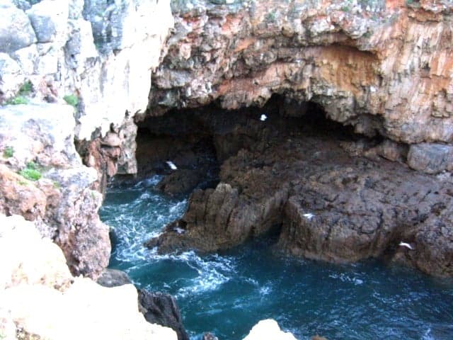 Waves crashing into the Boca do Inferno blow-hole on São Tomé's coast