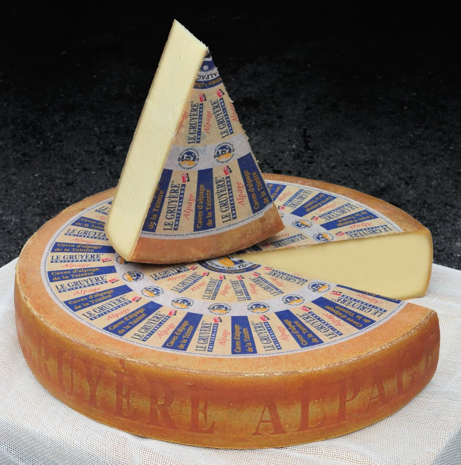 Big wheels of Swiss Emmental cheese with characteristic round holes