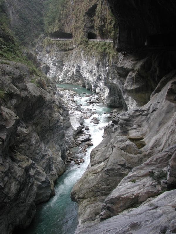 A river winding through the tall marble walls of Taroko Gorge