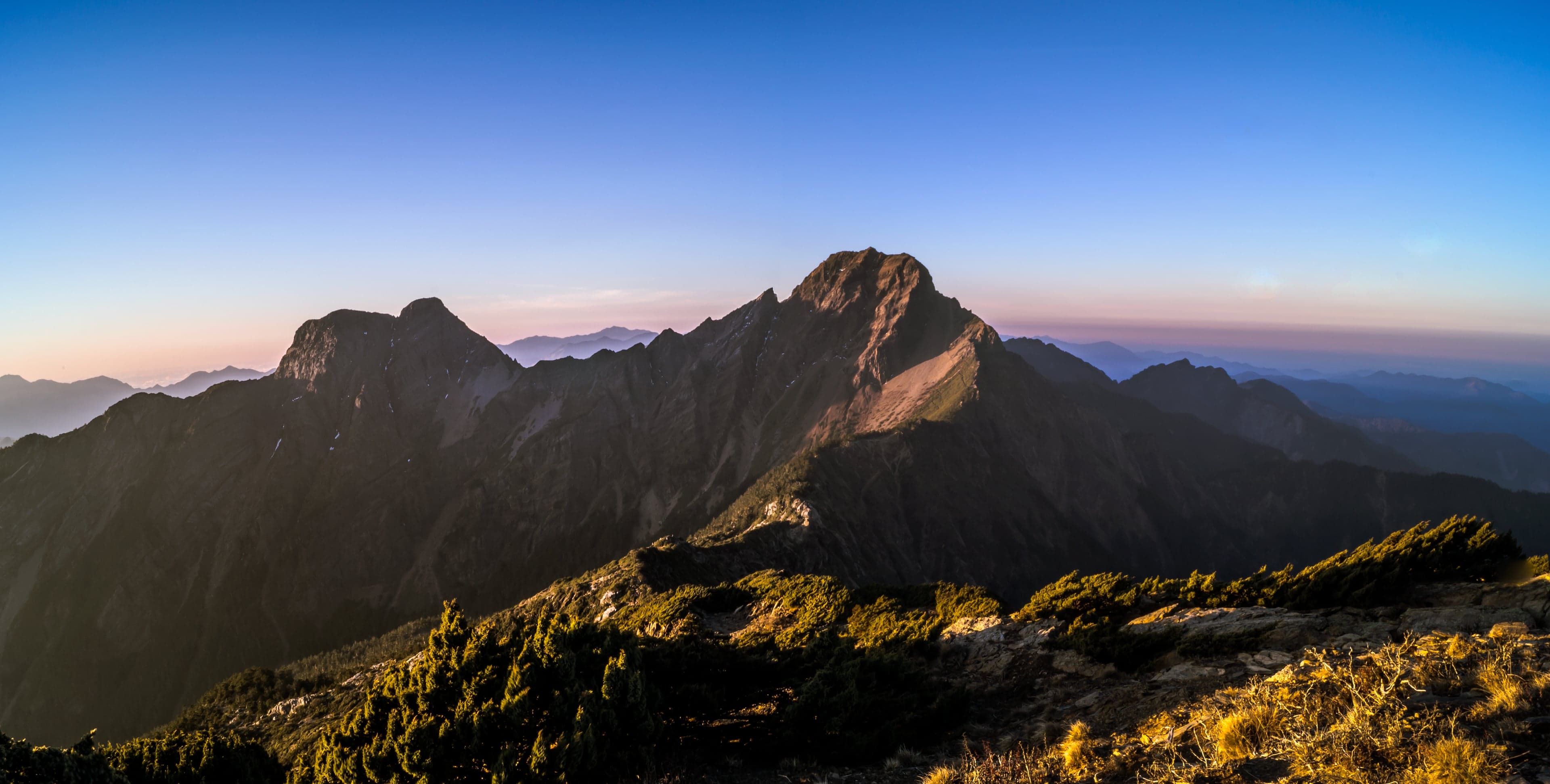 The snow-capped peak of Yushan rising above clouds