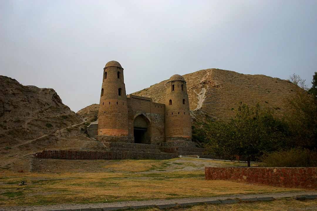 The great mud-brick gateway of Hisor Fortress rising above the surrounding landscape