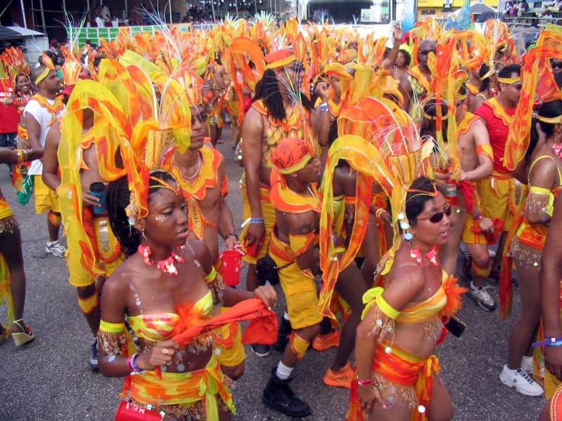 Costumed masqueraders in brilliant feathered costumes at Trinidad Carnival