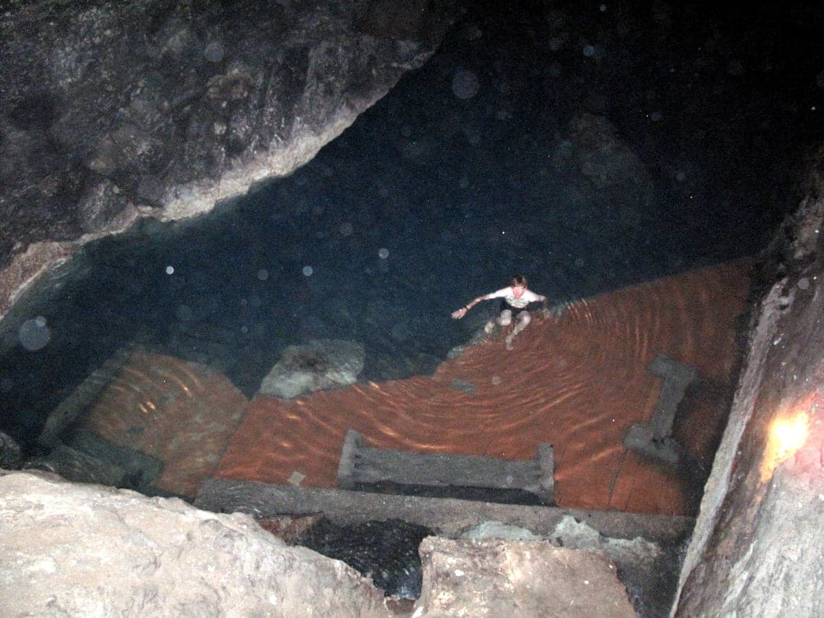 The glowing turquoise waters of Kow-Ata underground lake inside a vast cave