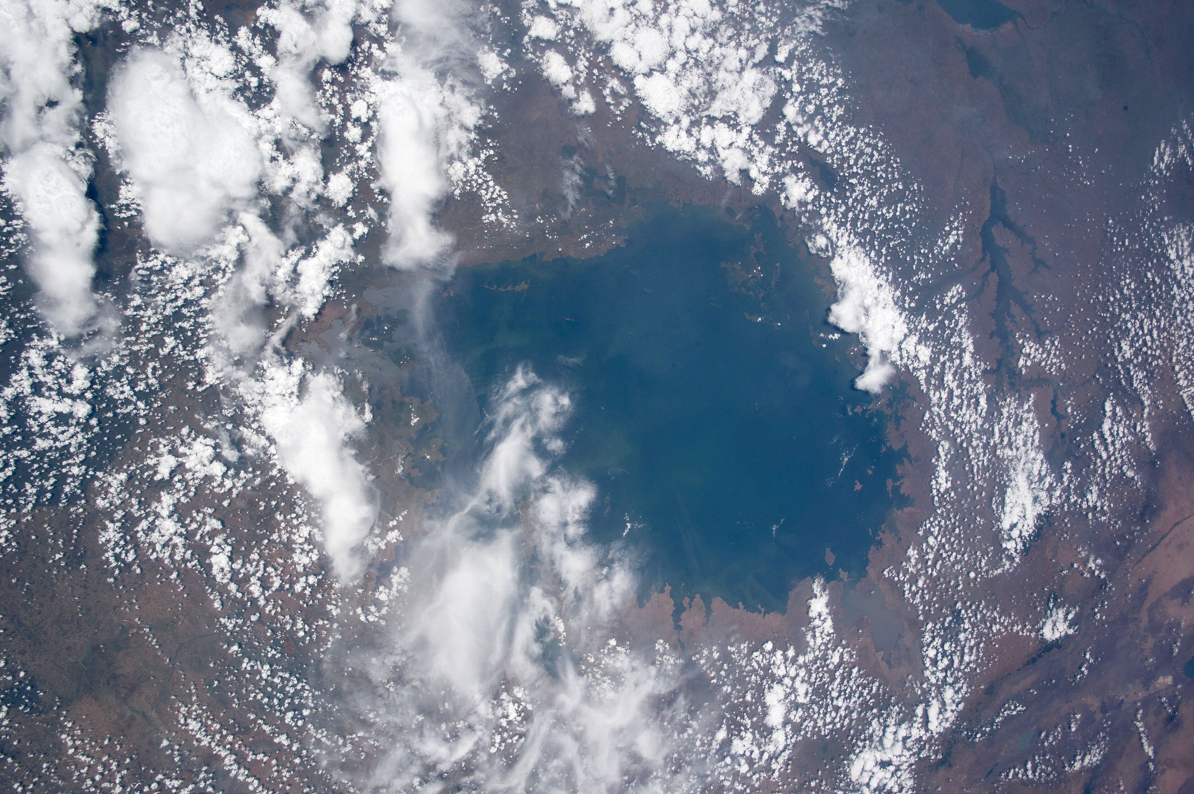 A wide view across the calm blue surface of Lake Victoria