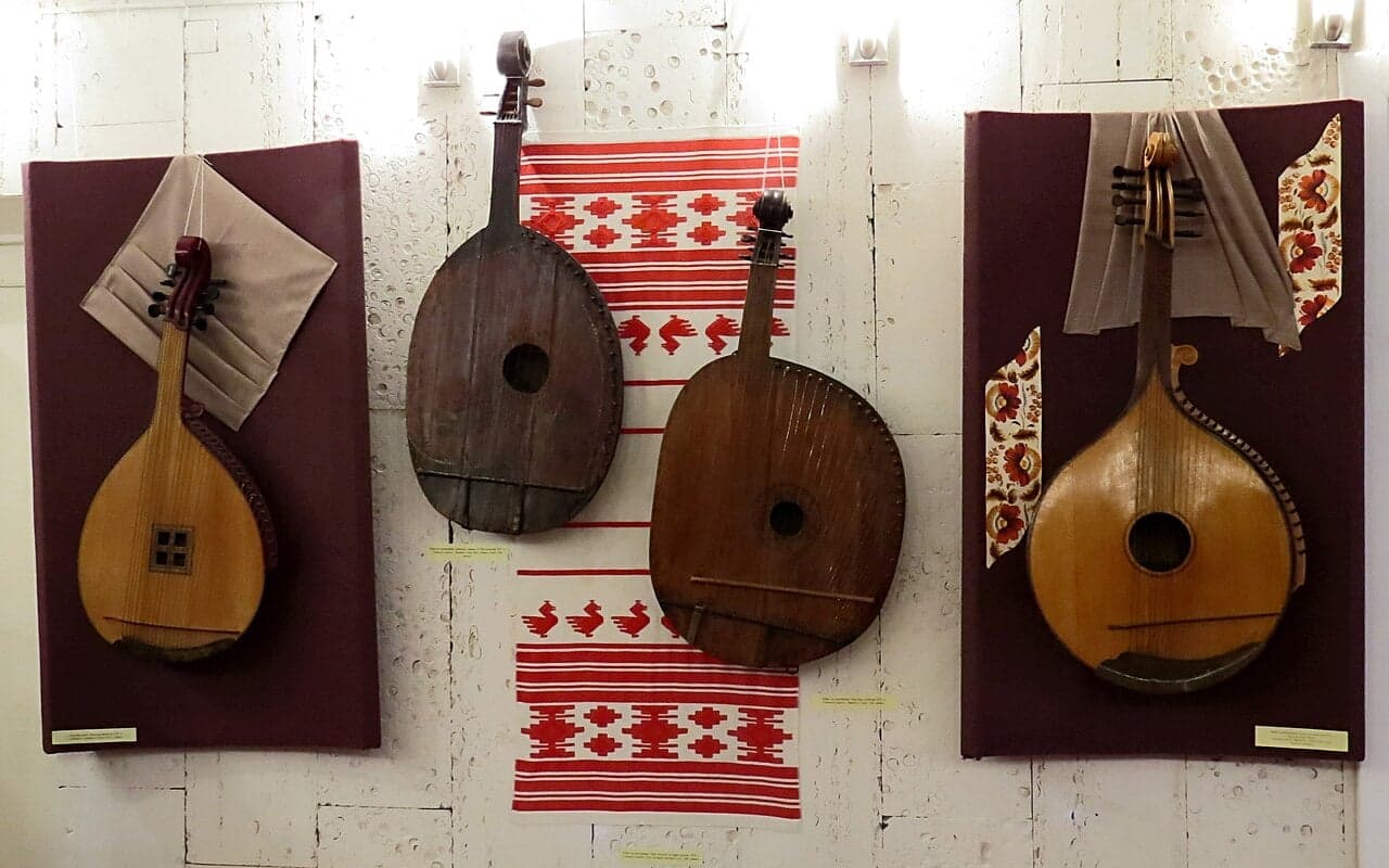 A traditional Ukrainian bandura with many strings being played