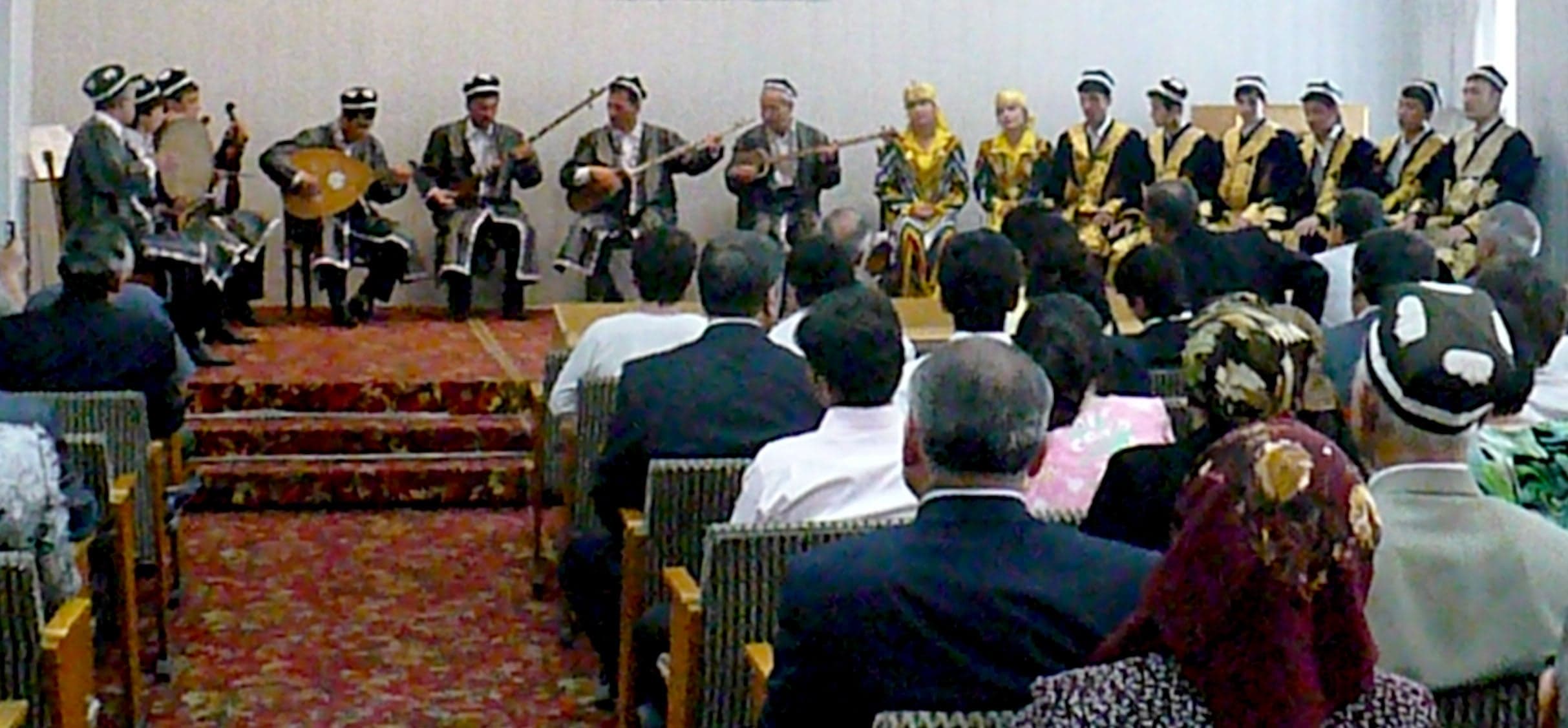 A group of Uzbek and Tajik musicians playing traditional Shashmaqam music together