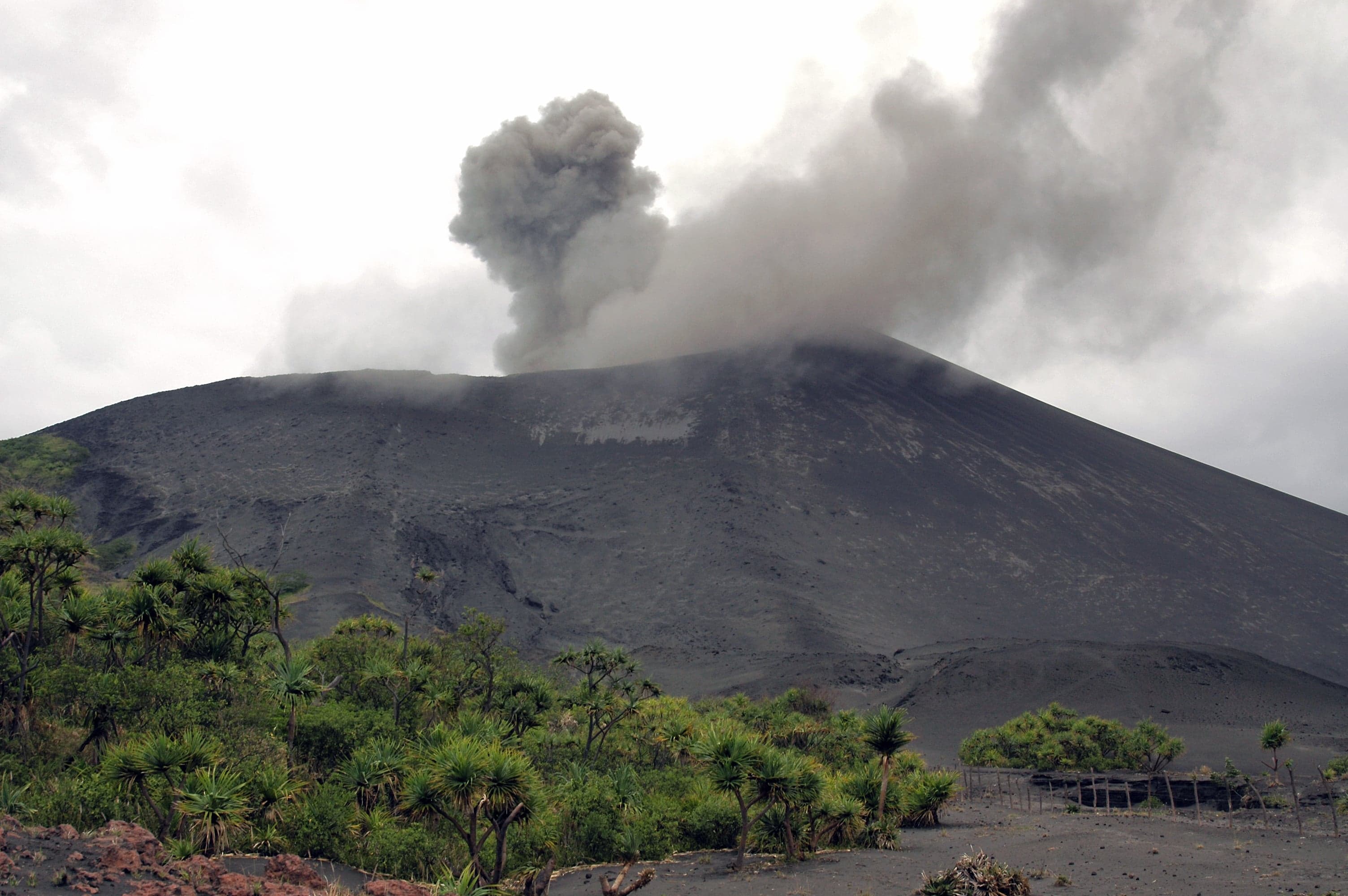 Mount Yasur volcano glowing orange at night on Tanna island, Vanuatu