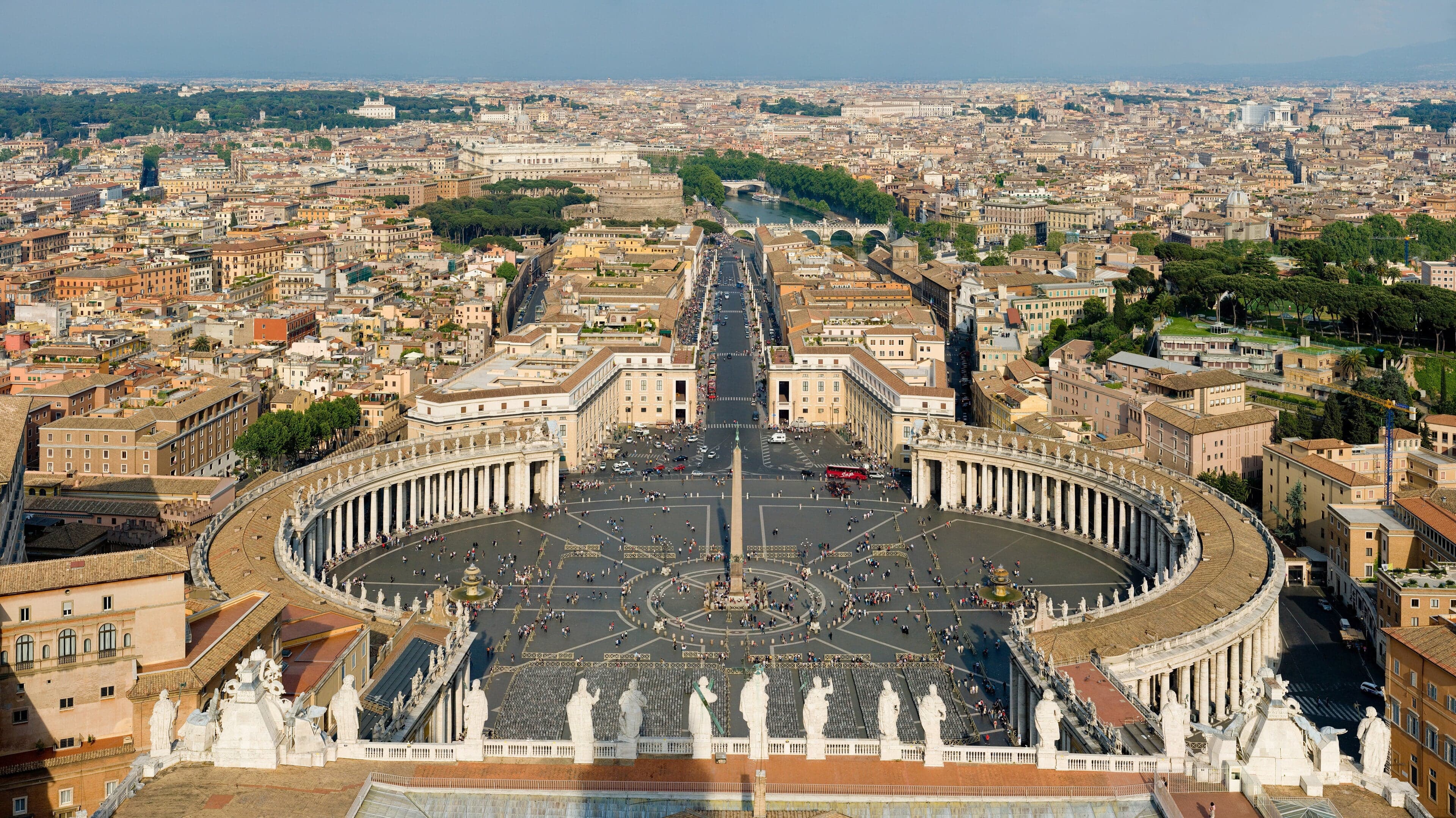 An aerial view of St Peter's Square in Vatican City showing the oval colonnade and central obelisk