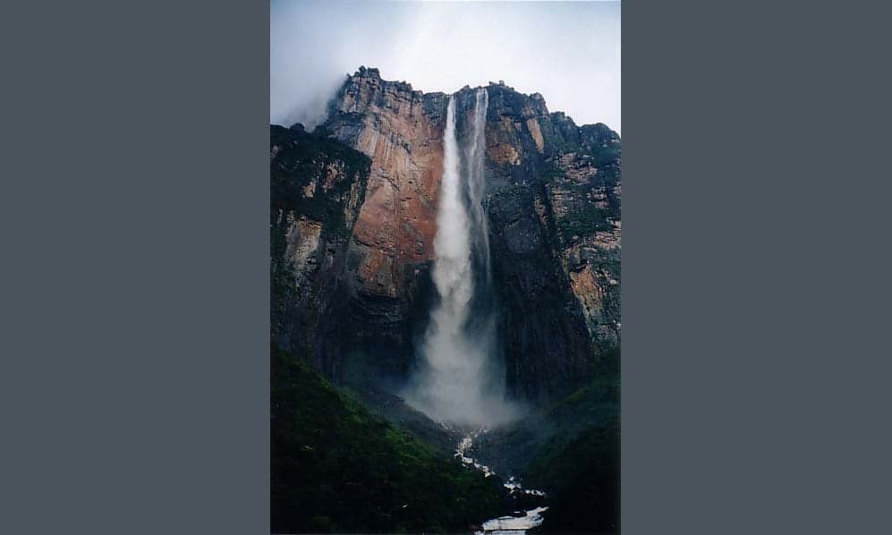Angel Falls tumbling down the side of a flat-topped mountain in the Venezuelan jungle