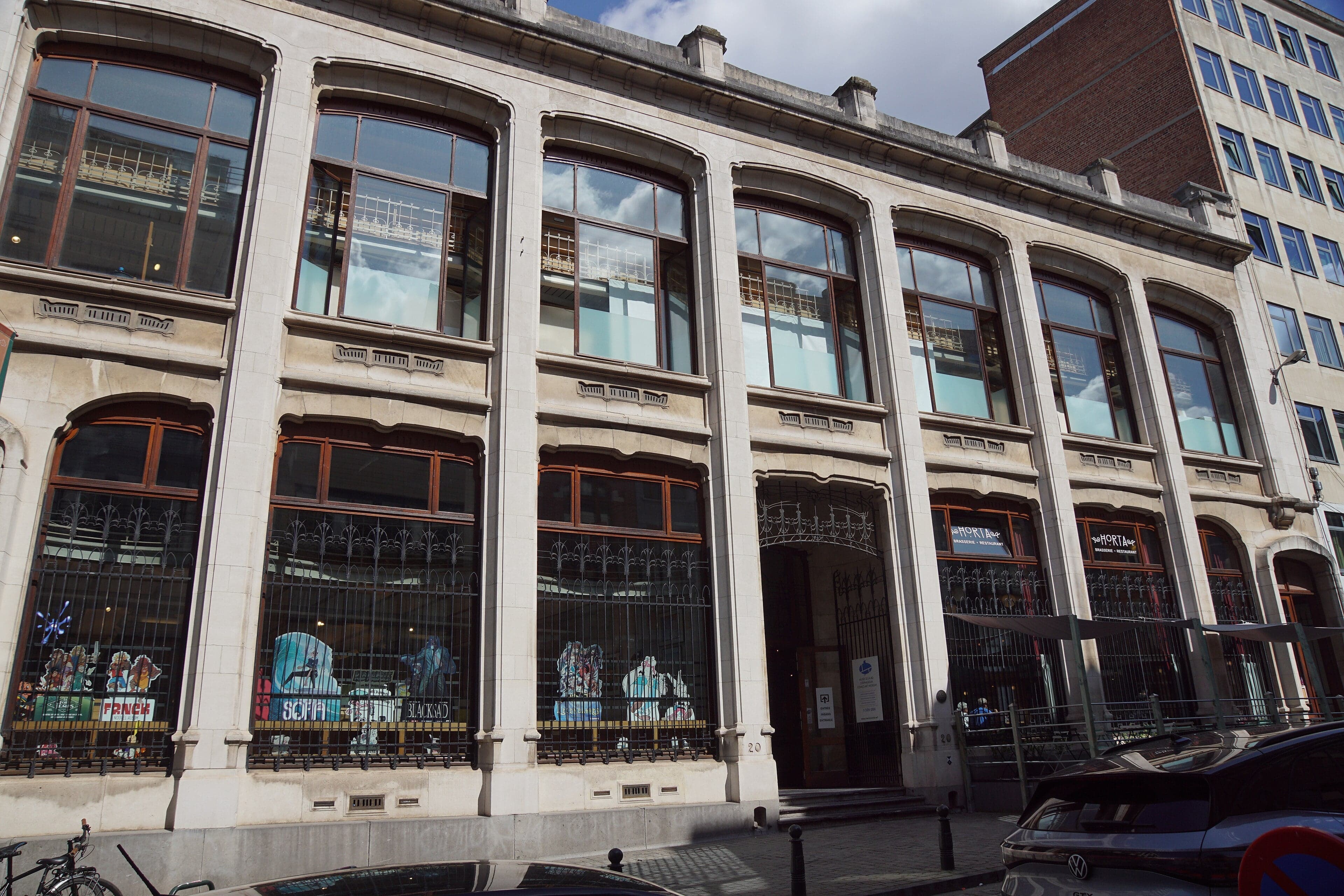 A large colourful comic-strip mural painted on the side of a Brussels building