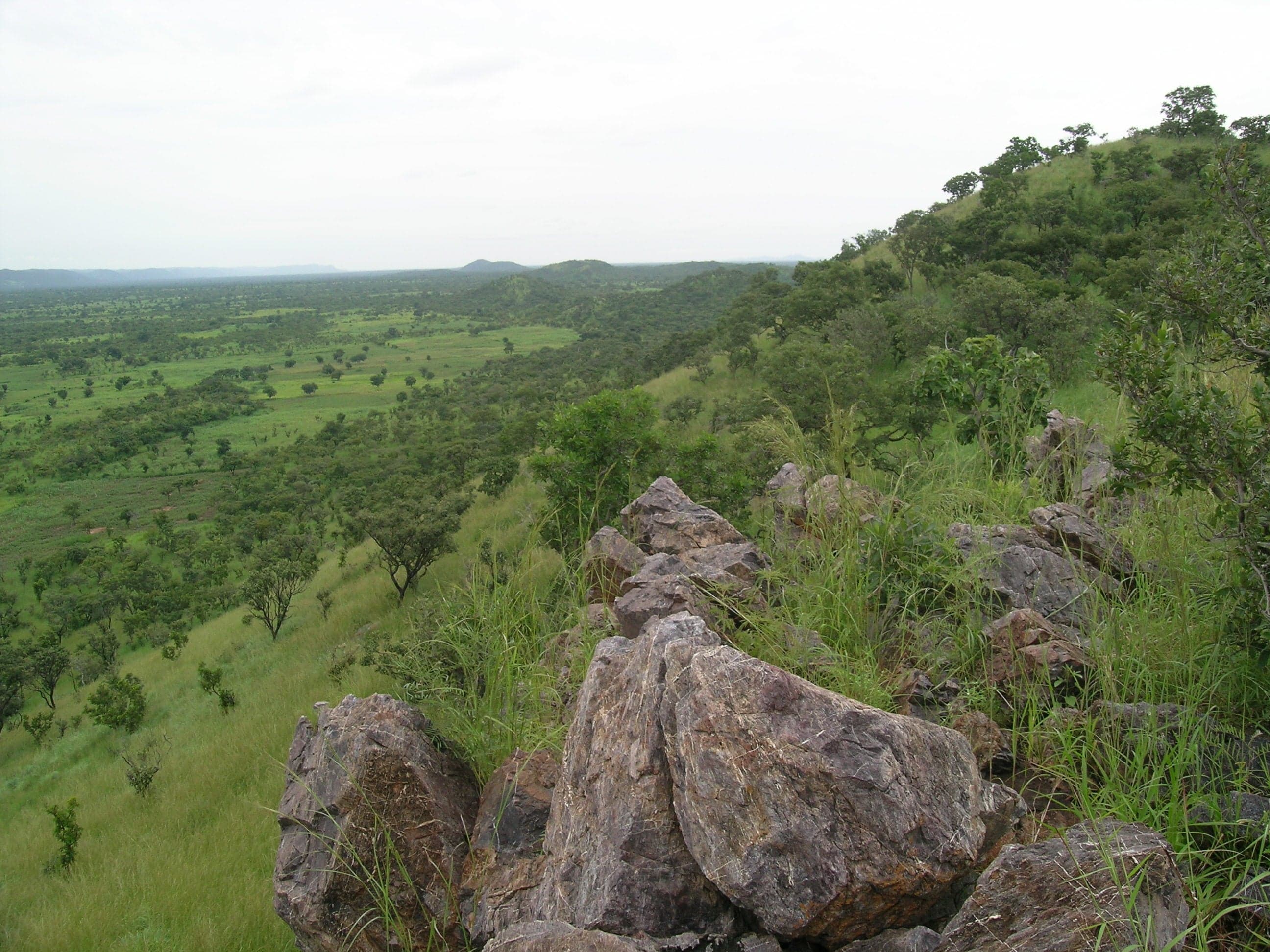 Rolling green hills and rocky peaks of the Atakora Mountains in northern Benin
