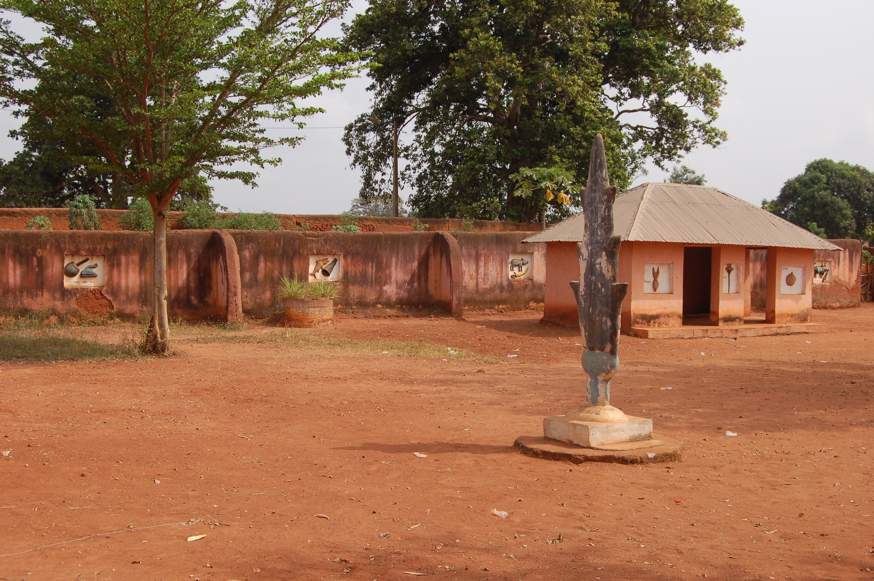 Colourful bas-relief carvings on the walls of the Royal Palaces of Abomey