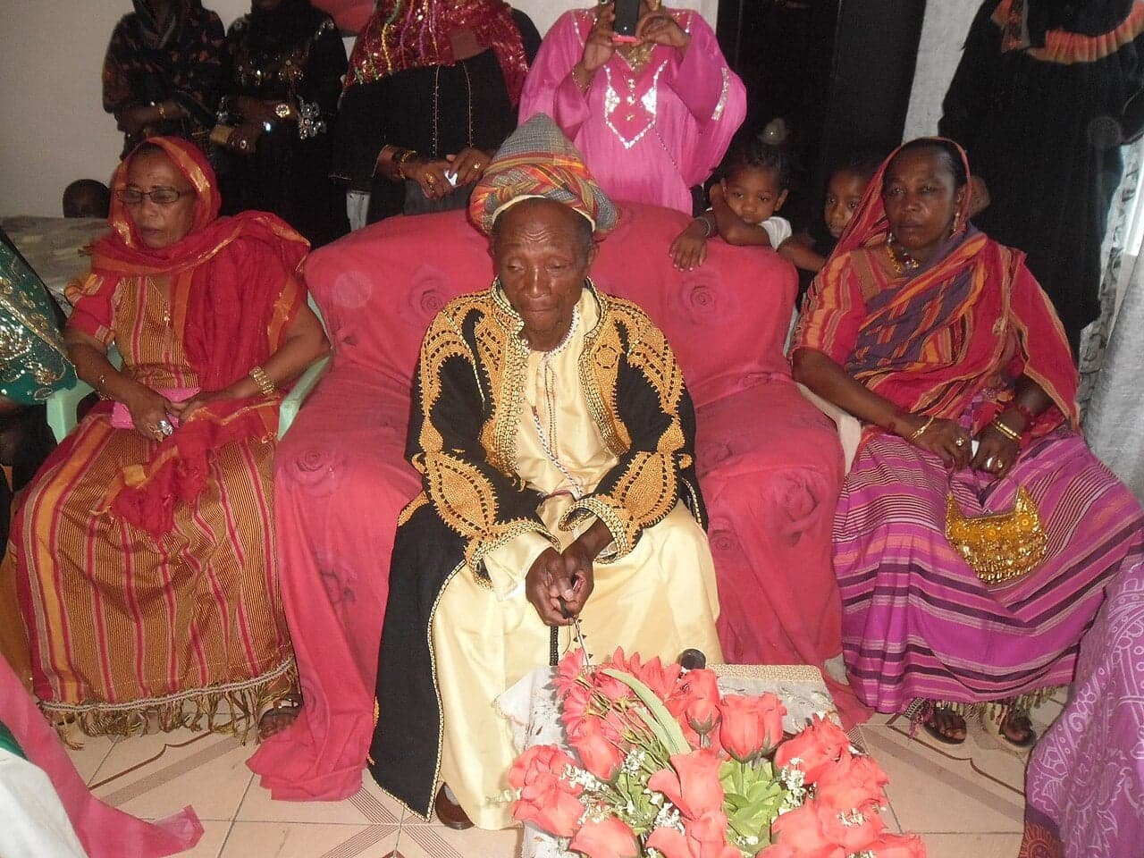 Colourfully dressed guests dancing and celebrating at a Grand Mariage community festival in Comoros