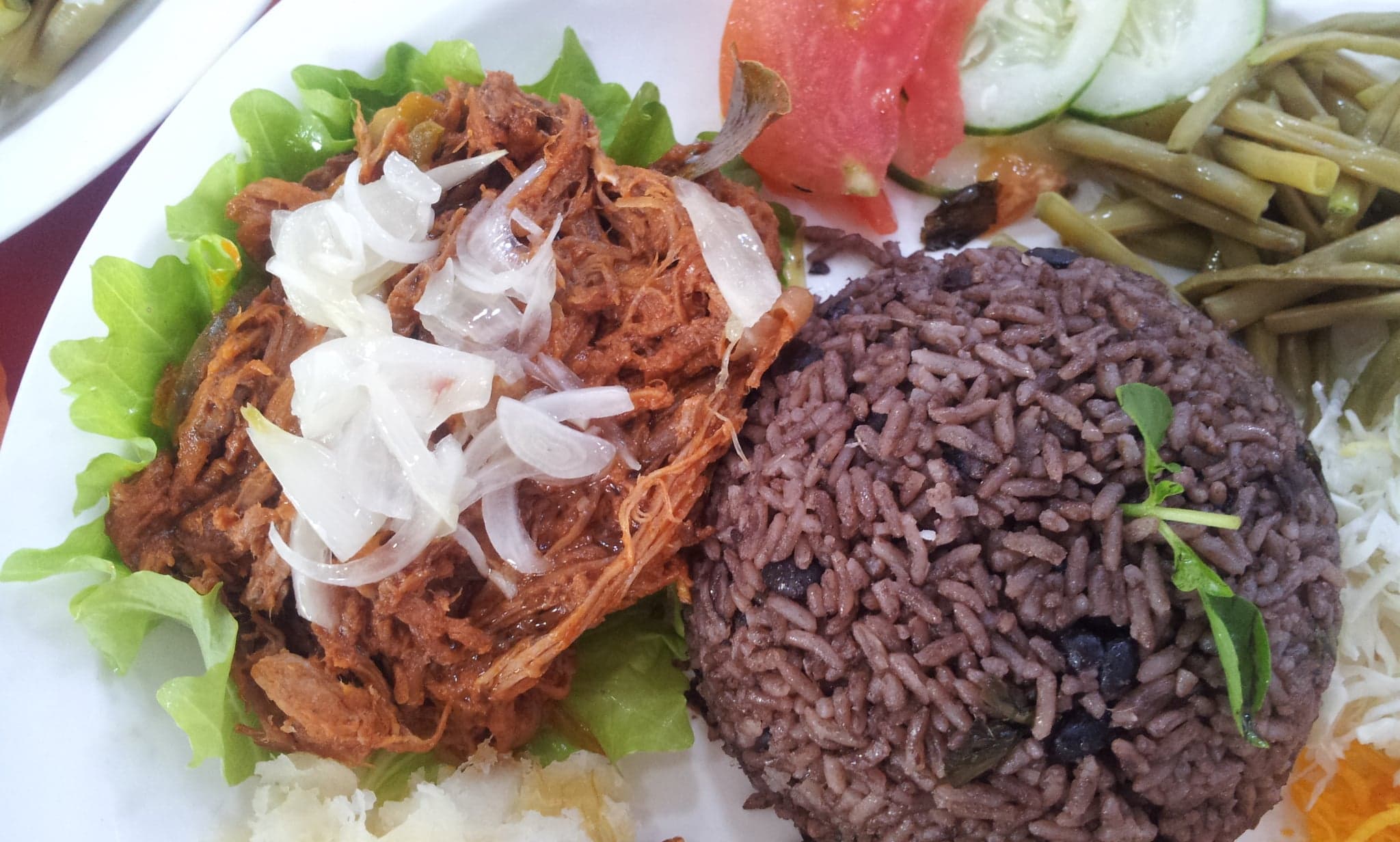 A bowl of congrí - black beans and rice cooked together with herbs and spices