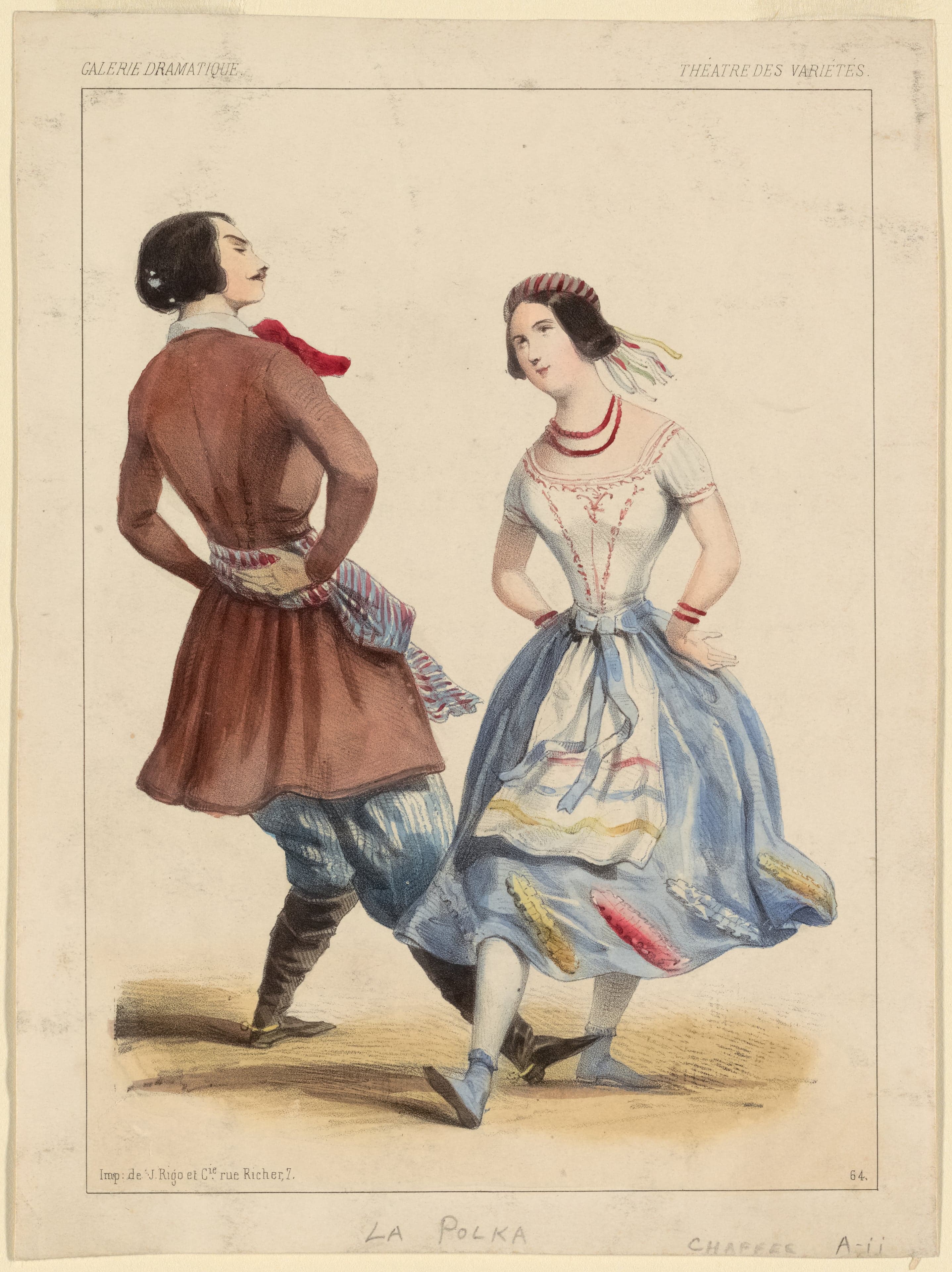 A couple in Czech folk costume dancing the polka at a village festival