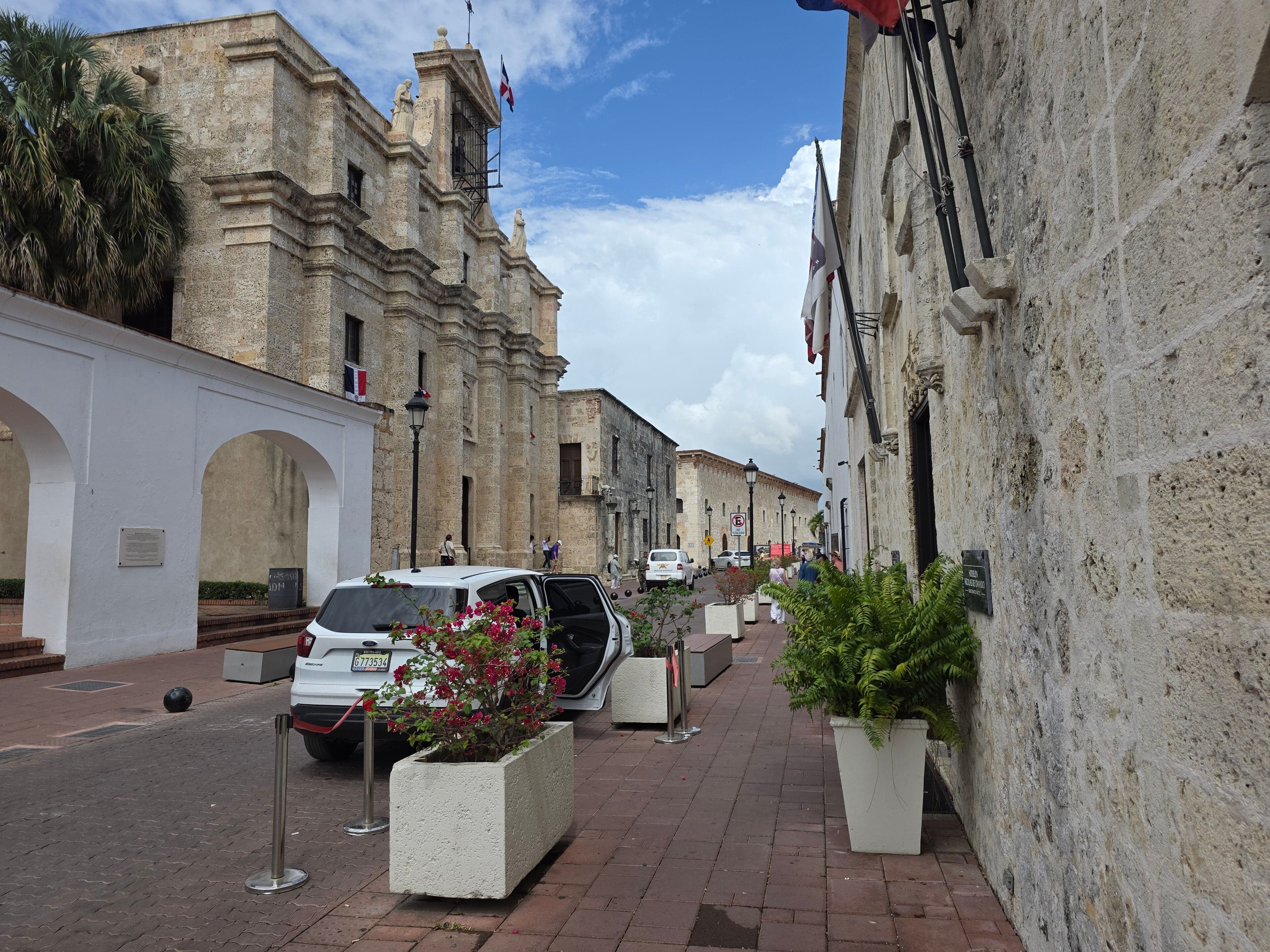 Colourful colonial buildings lining a cobblestone street in Santo Domingo's Zona Colonial