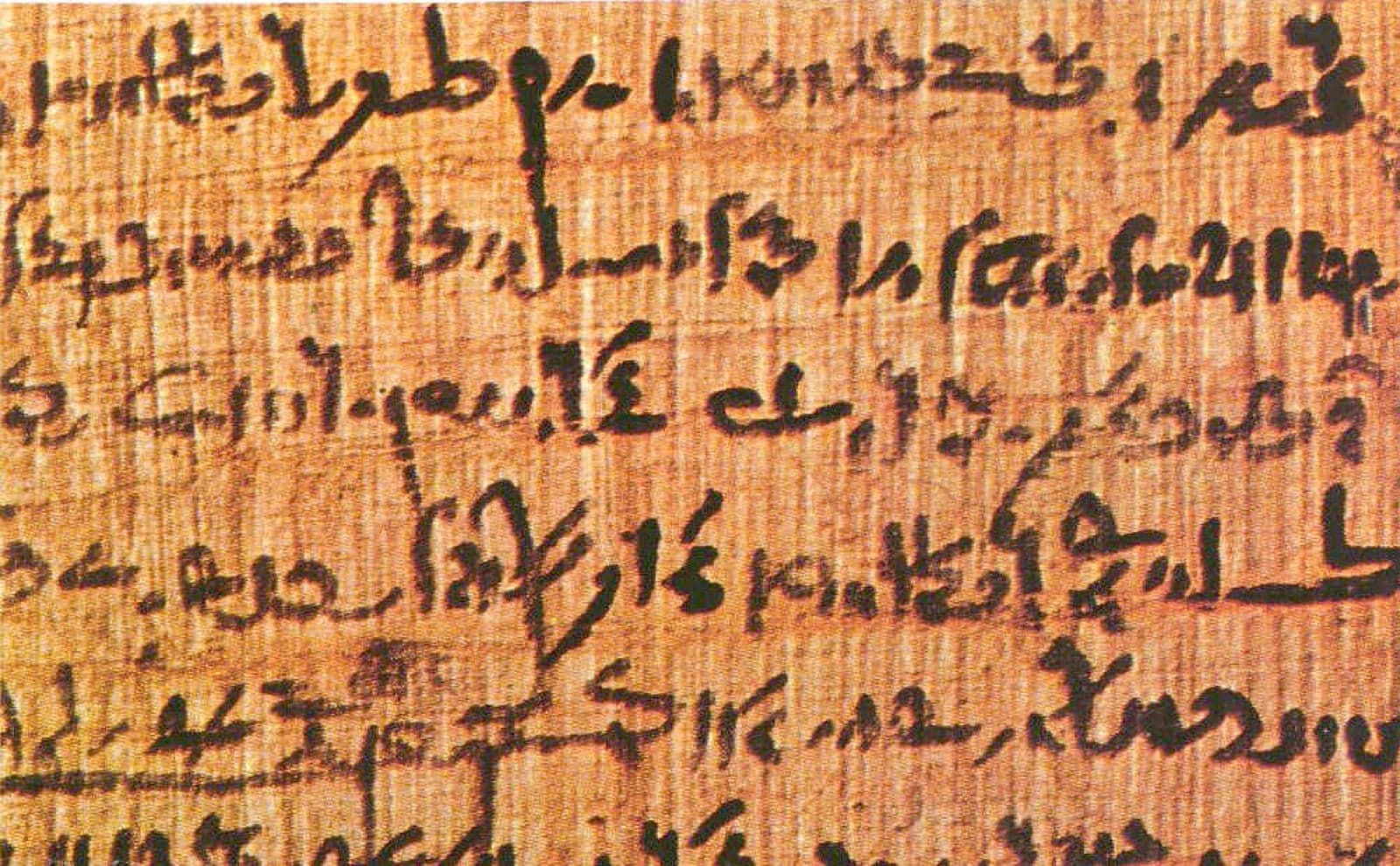 An ancient Egyptian papyrus scroll with handwritten script